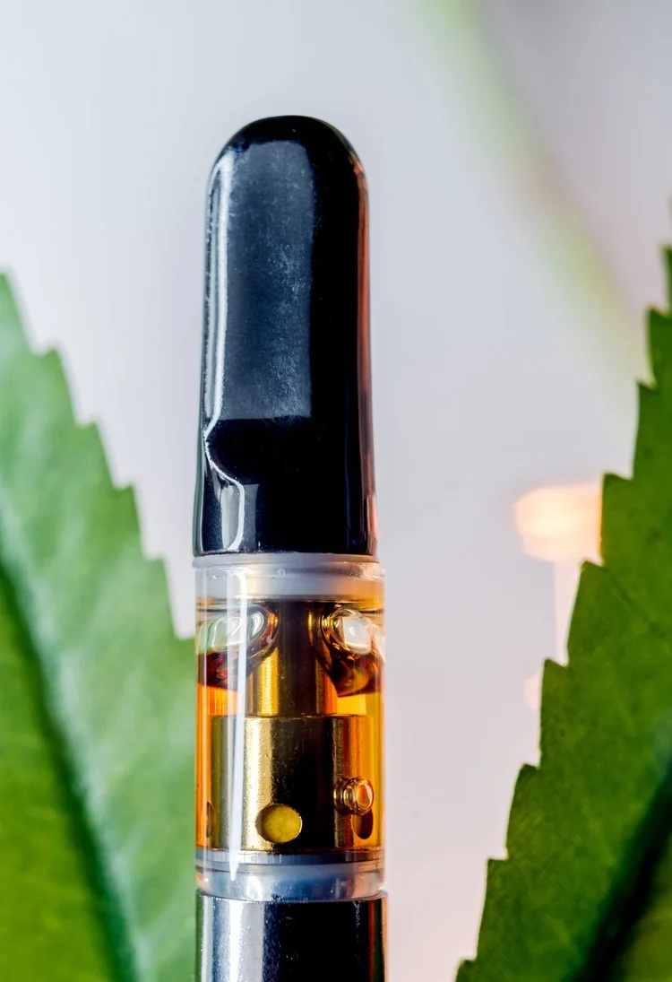 THC vape cartridge with thick amber oil