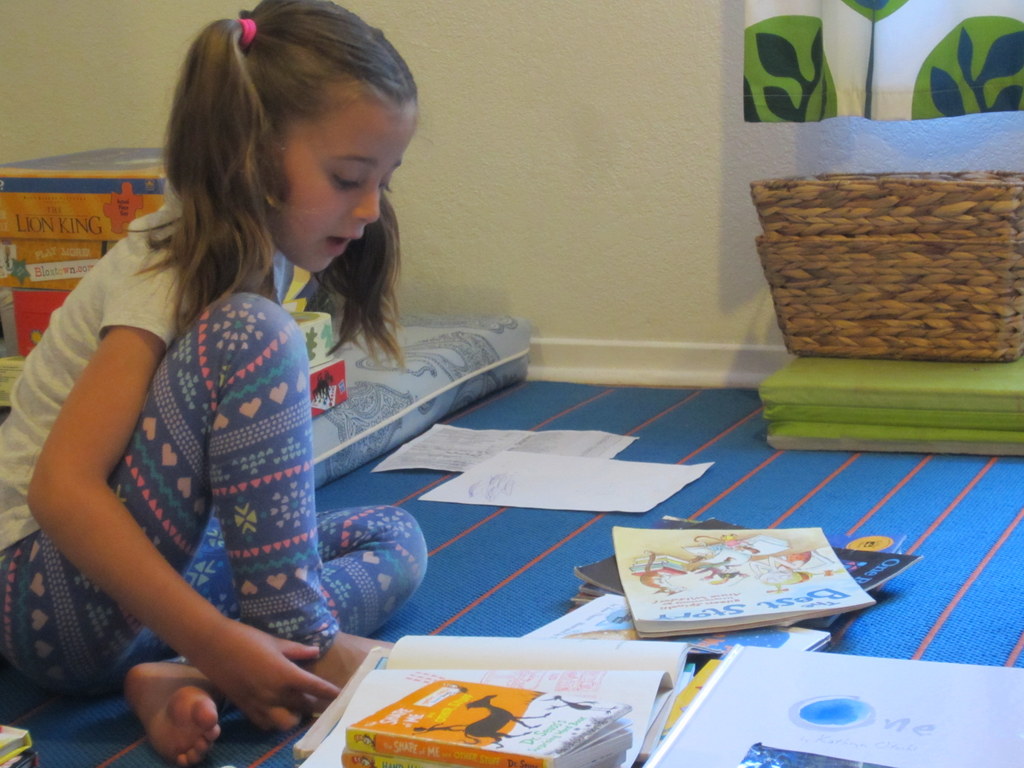 Pausing to read while we pack up books.