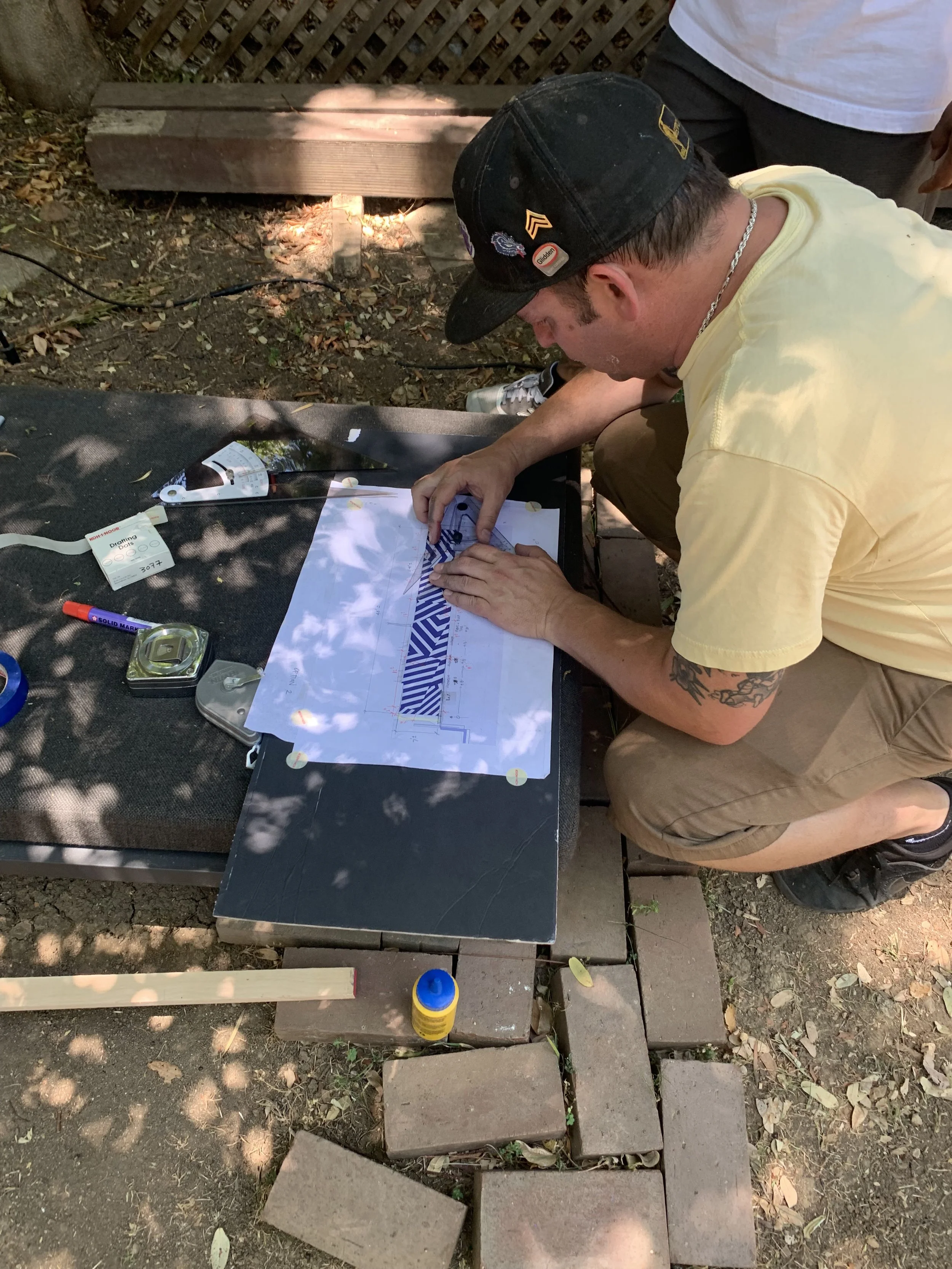 Kyle painting razzle dazzle wall 2.jpeg