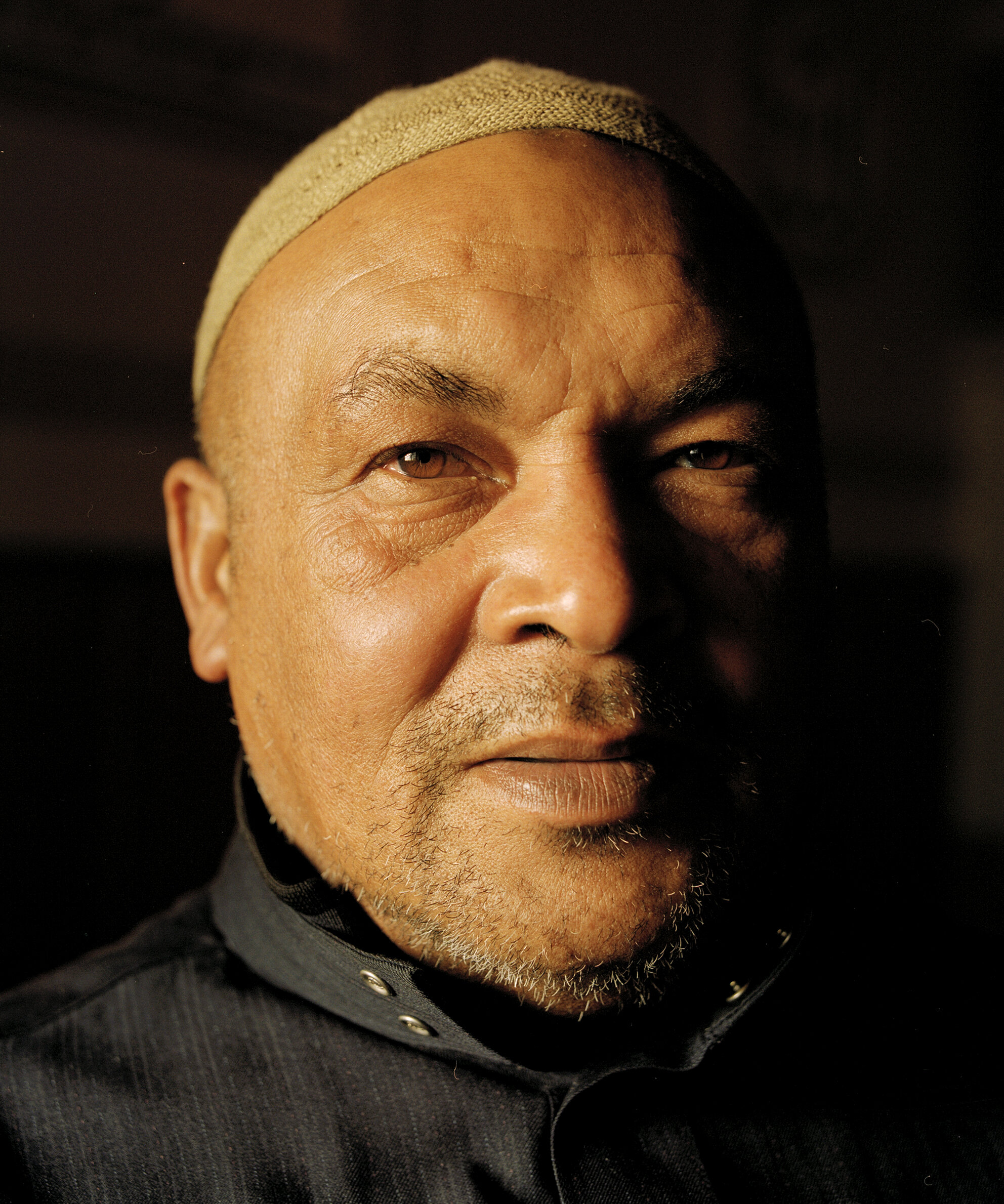  152 Families  This photograph of Imam Omar Davis was taken at the Constantia Mosque, Spaanschemat River Road, Belle Constantia. This mosque was kept open despite Apartheid’s laws due to the resilience of the congregation when 152 families bought the