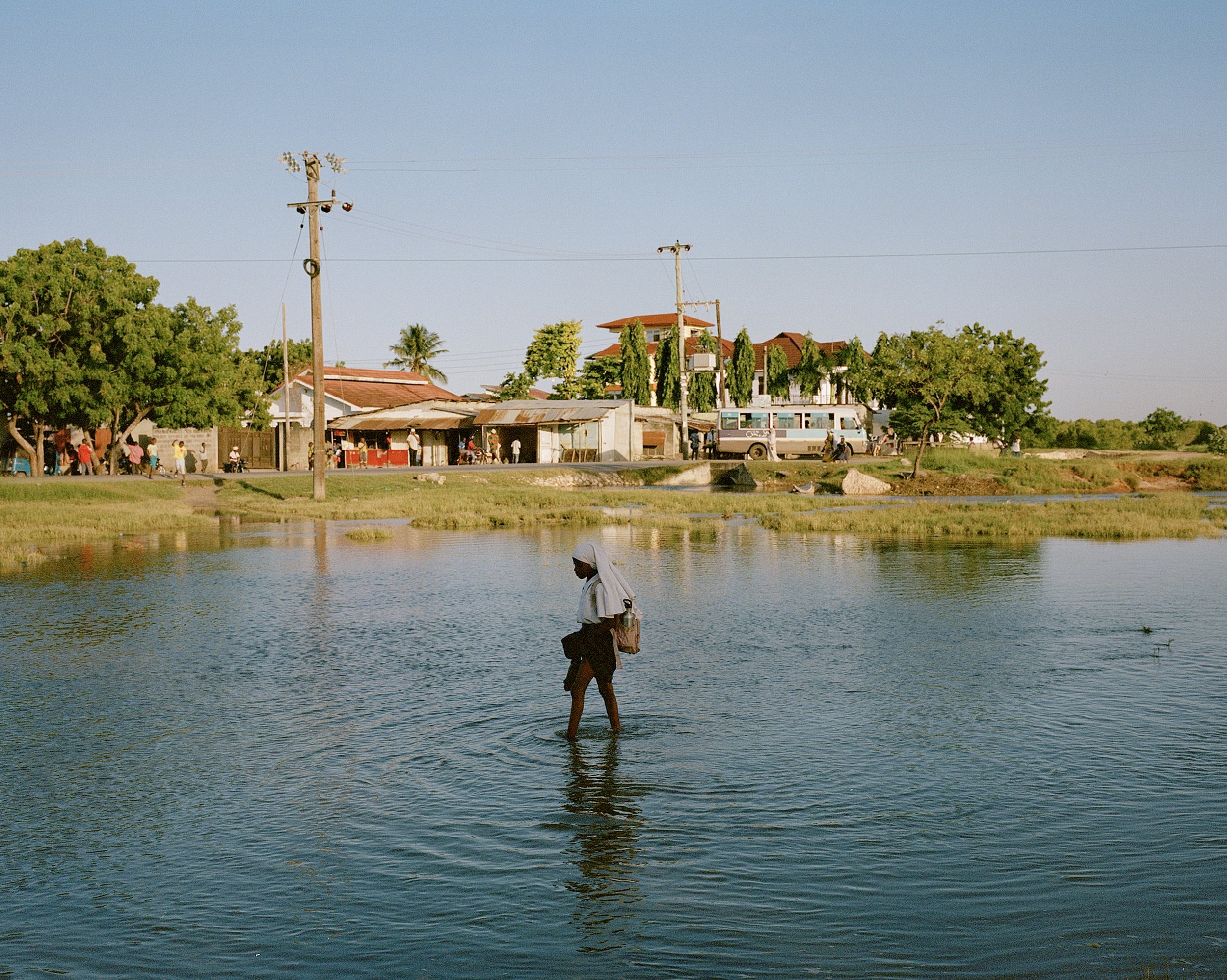  Returning Home From School, Dar Es Salaam  Part of a collection of images for WWF that form part of project on the communities that are safe guarding the precious mangroves of East &amp; Southern Africa.  