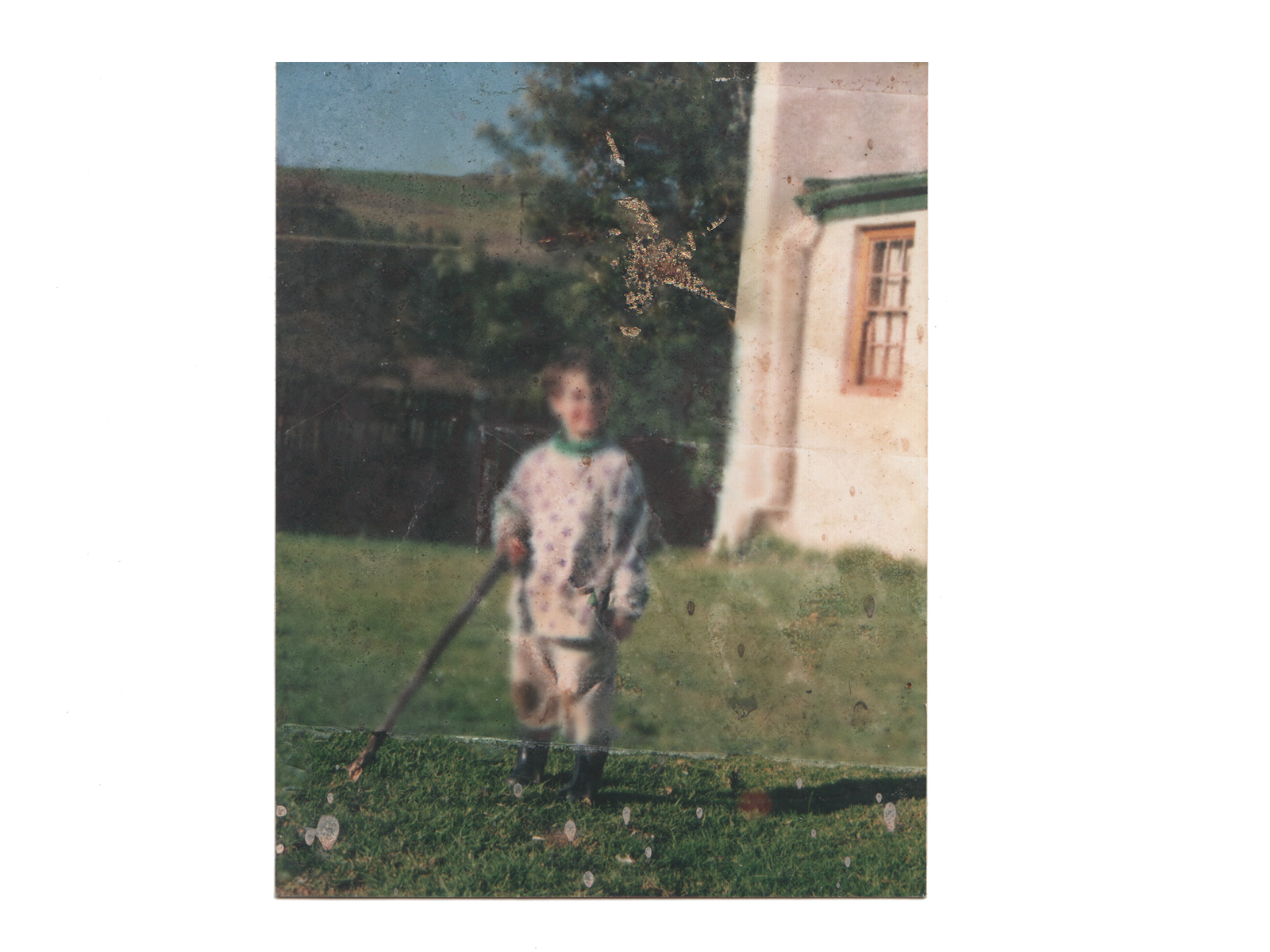  A damaged photograph of me and an imprint of a  gold star from one of my first “artworks”. 
