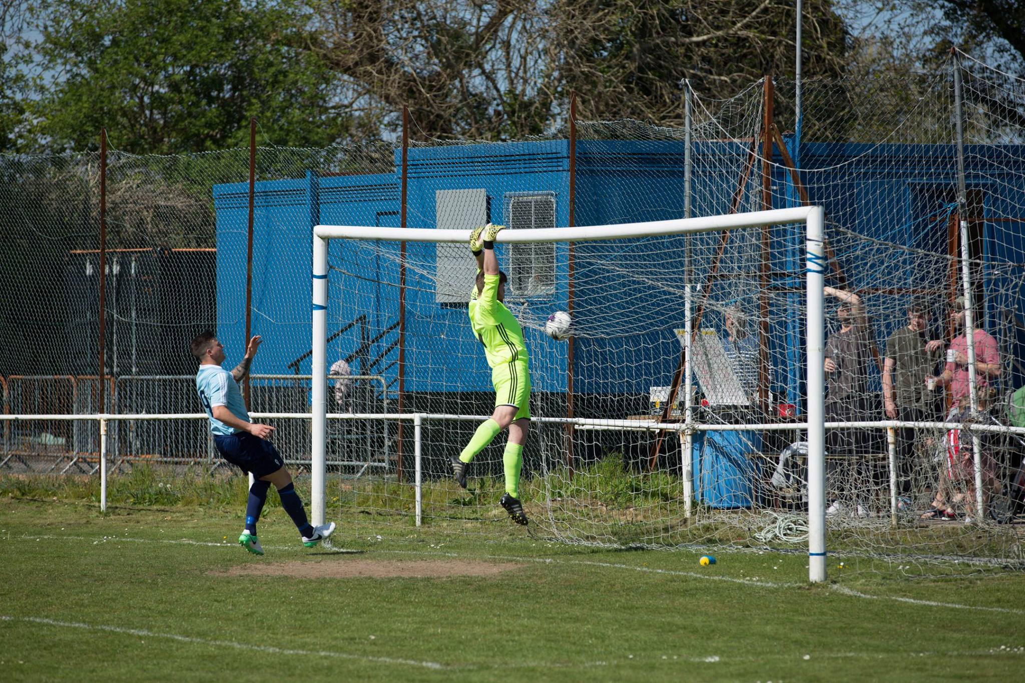 Brockenhurst goalkeeper watches the ball head over the cross bar