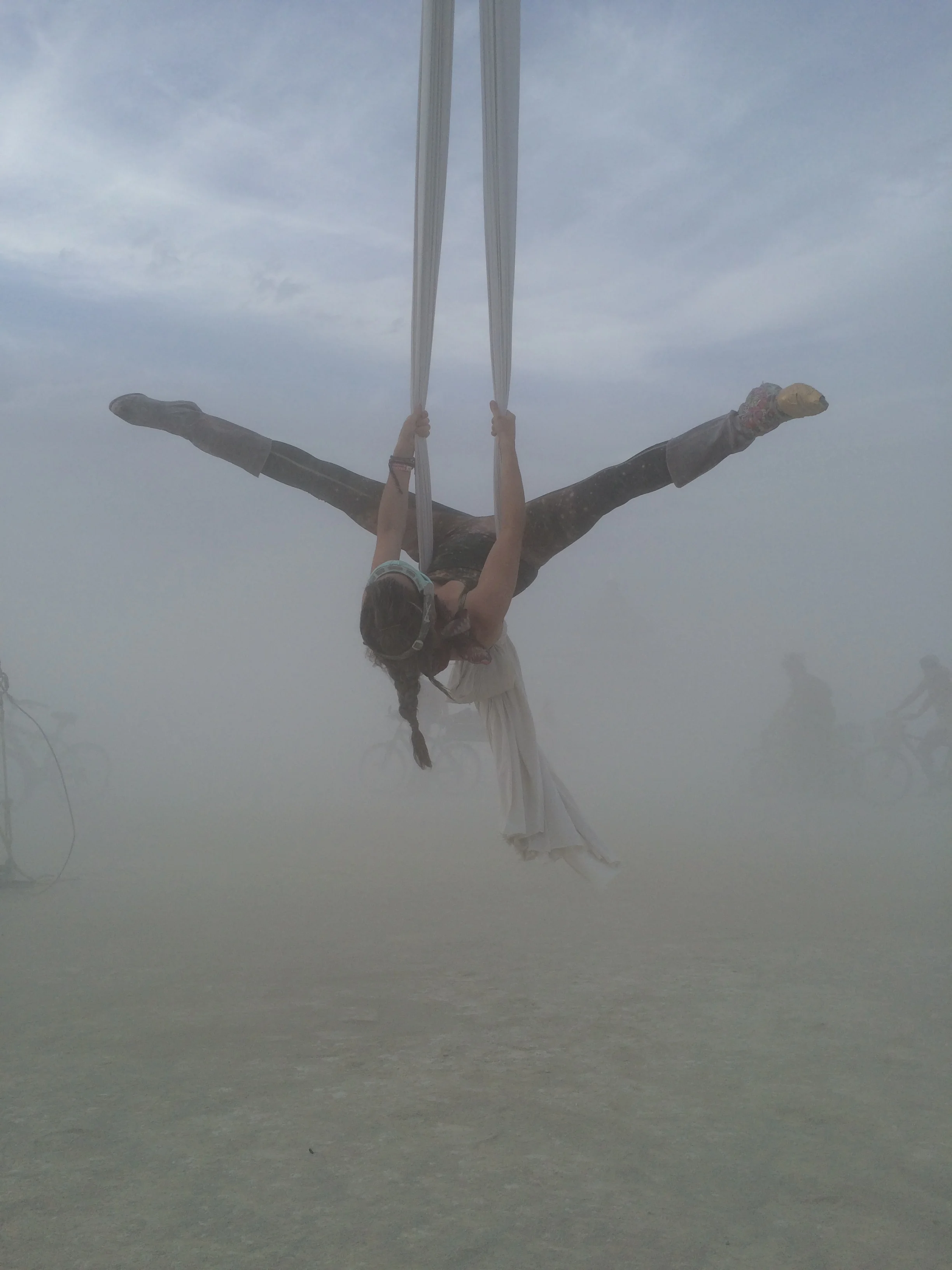 Maeve silking in the dust storm mere feet from the temple.