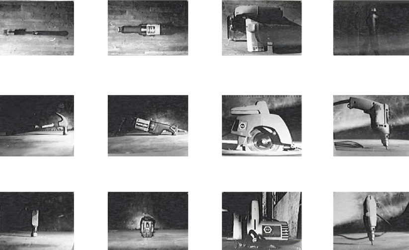 view of b/w photographs of tools inside box