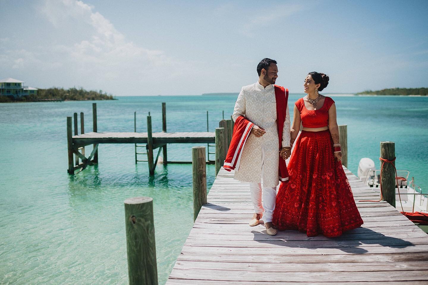 Love the contrast of the red dress against the turquoise water!