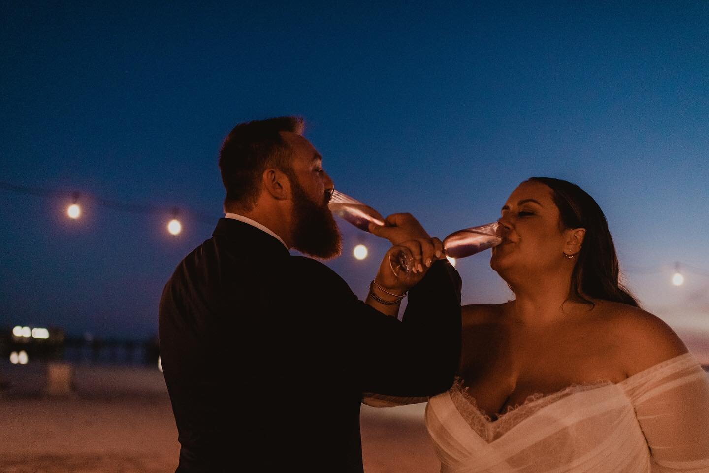 First toast as Mr. &amp; Mrs. // #newlywedtoast #cheers #abacoweddingphotography