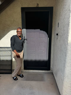 Boss client beside an installed security screen door