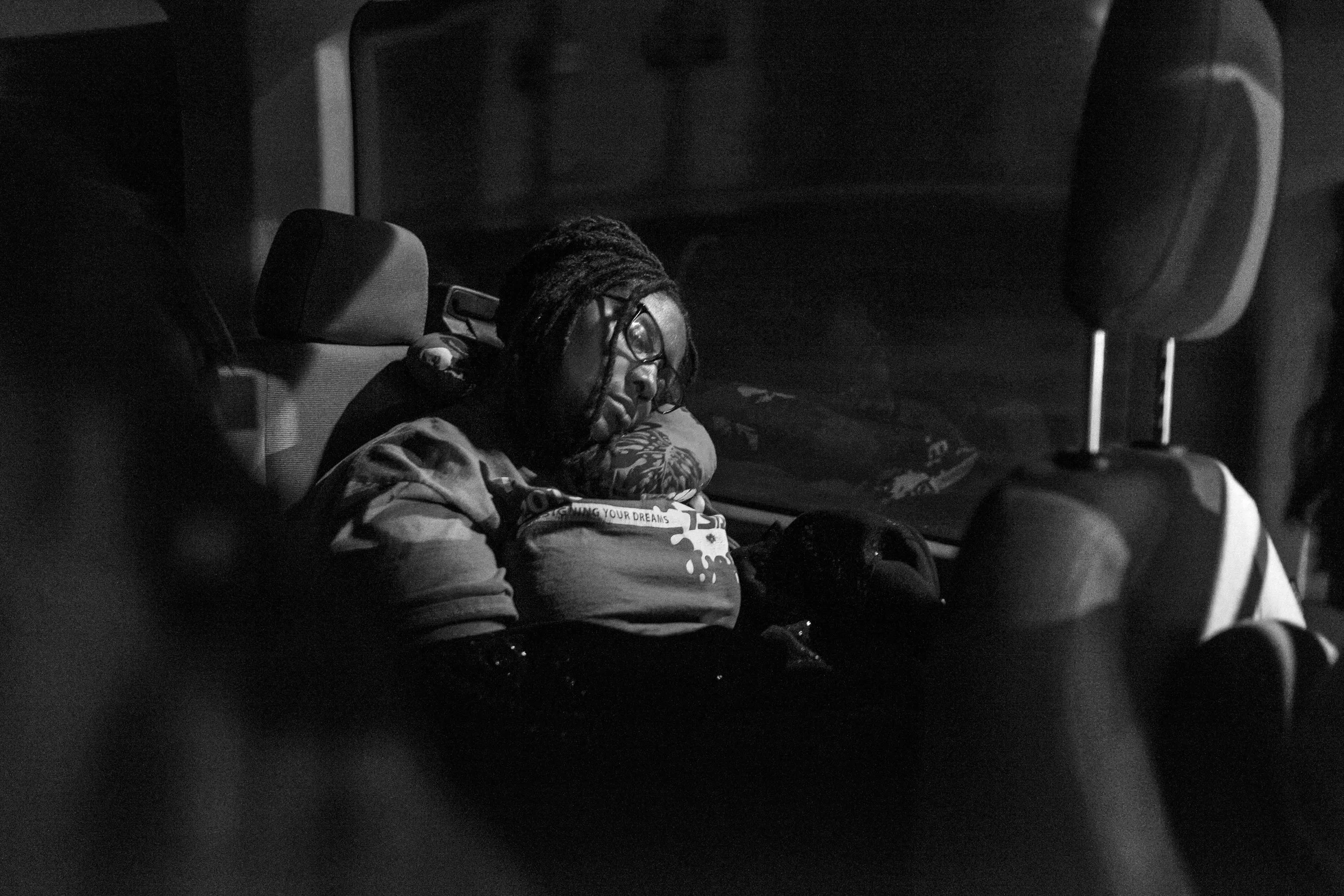 Sabrina Turner sleeps on the over night trip to Wise County, Virginia.
