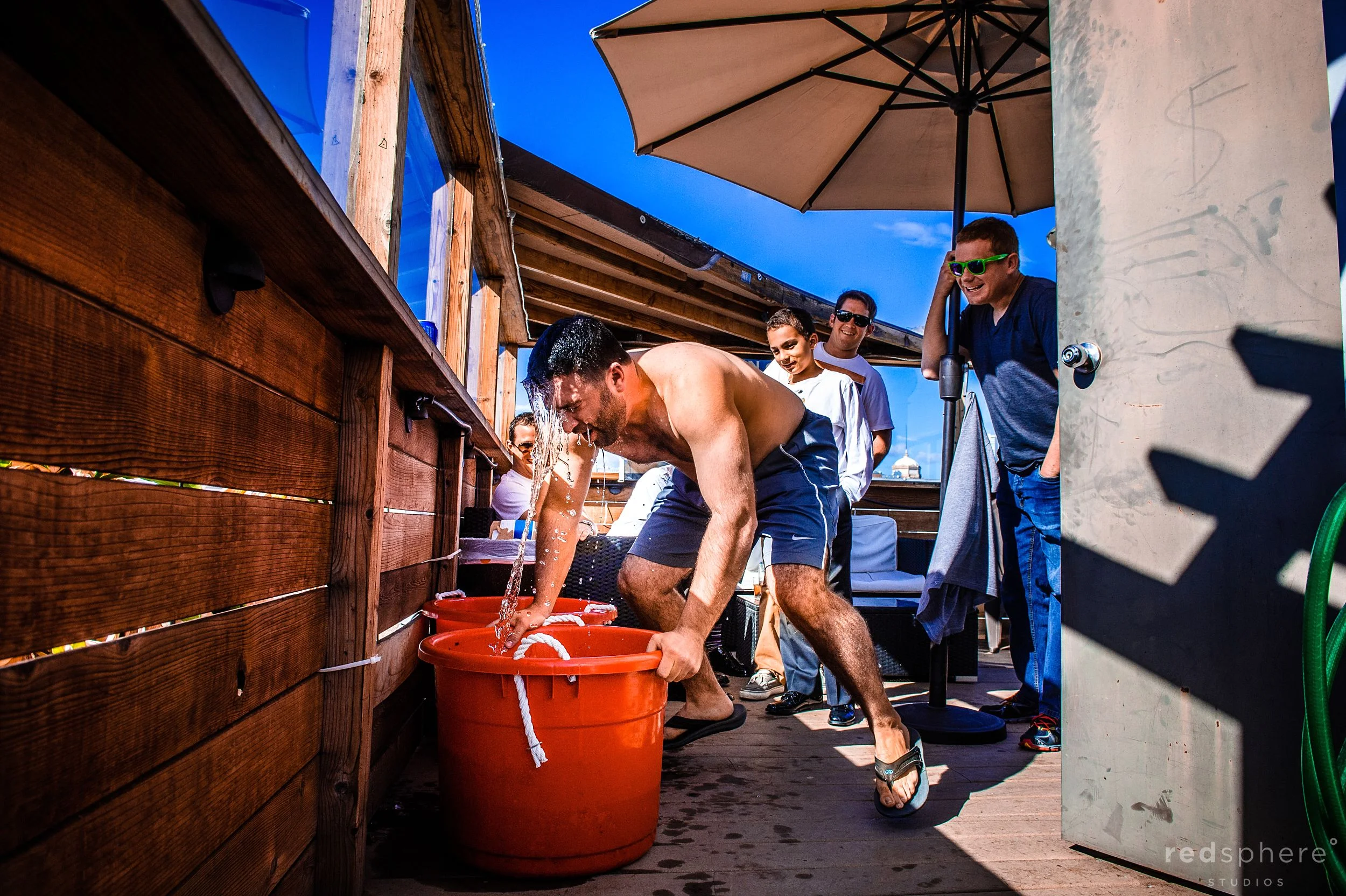 Groom Dunks in Bucket Full of Water as he Preps for his Wedding day
