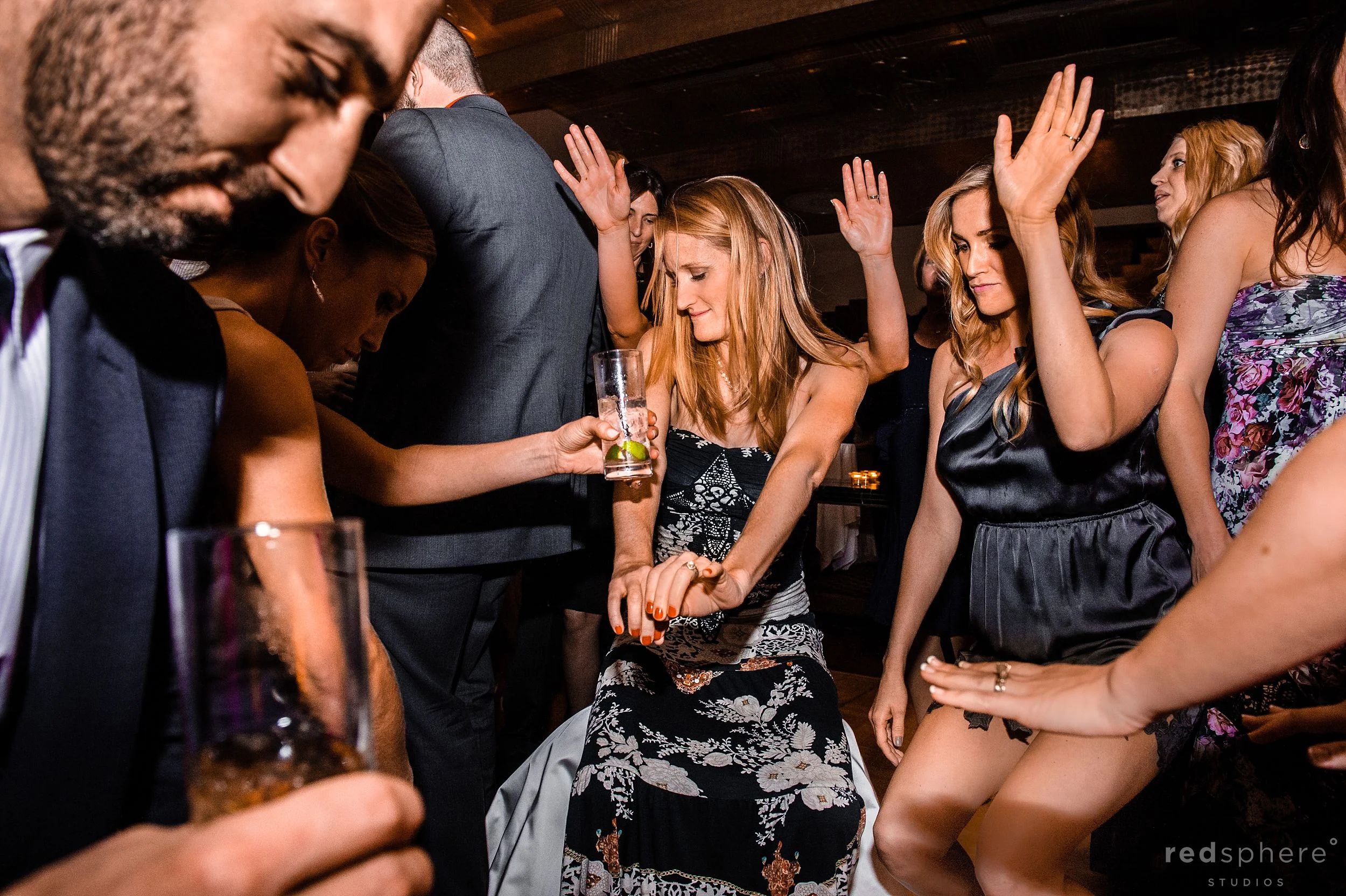 Guests Putting Their Hands Up and Dancing at City Club Wedding After Party