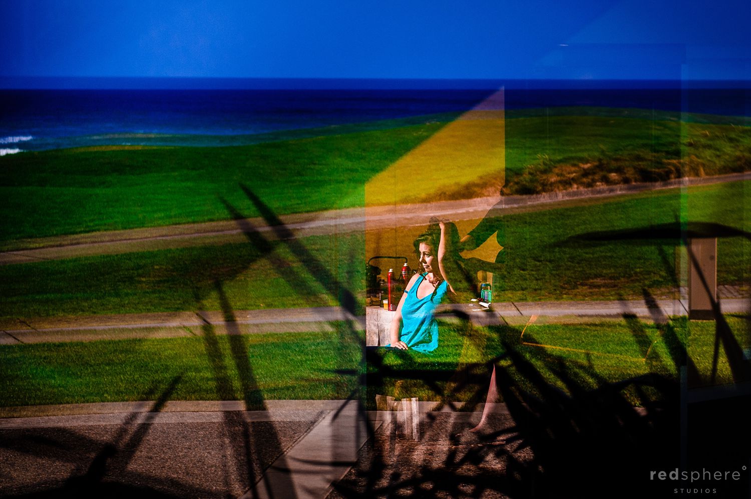 Window Reflection of Bride Preparing for Pebble Beach Wedding