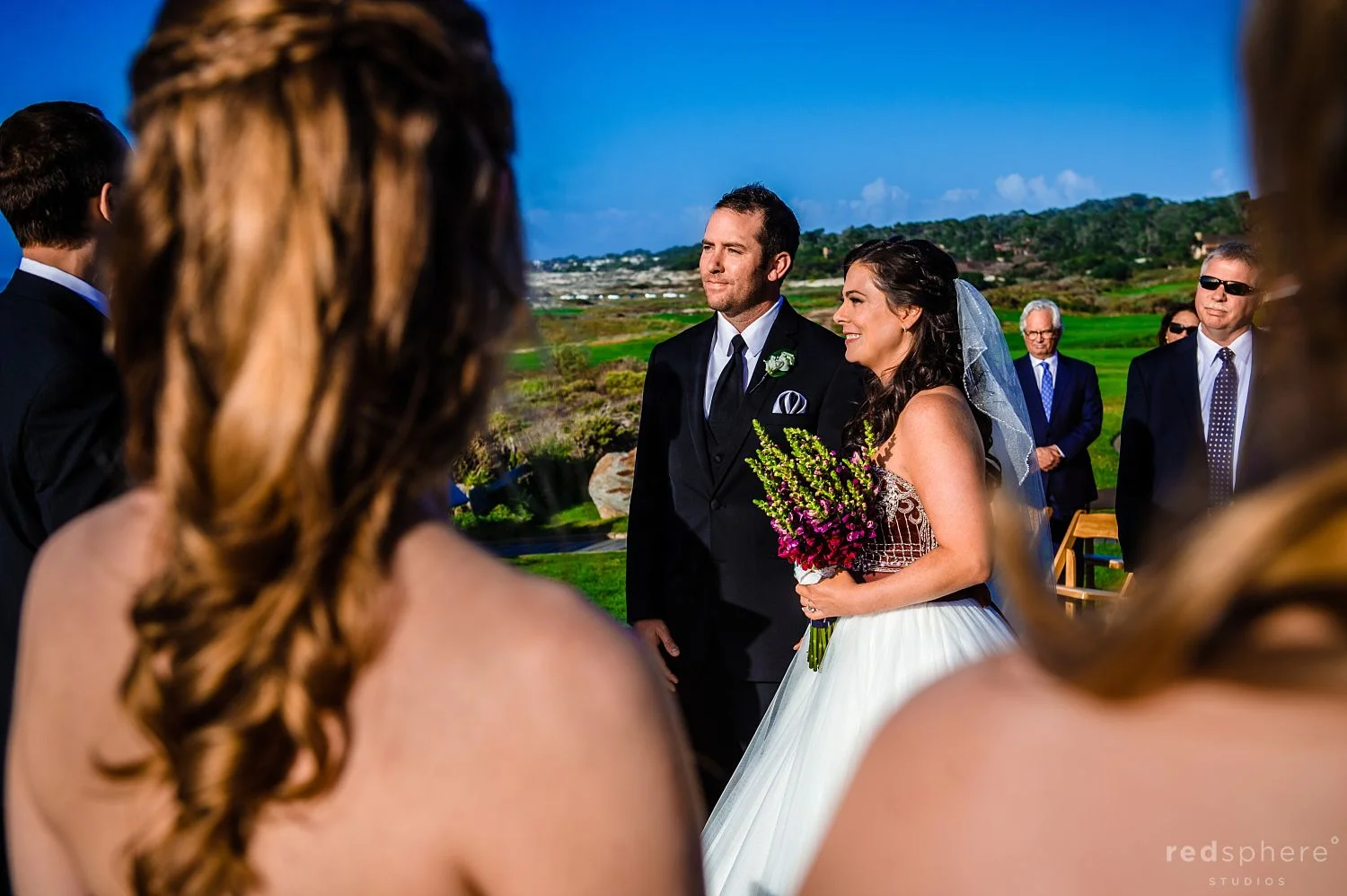 Guest View of Bride and Groom Looking Towards Their Officiant