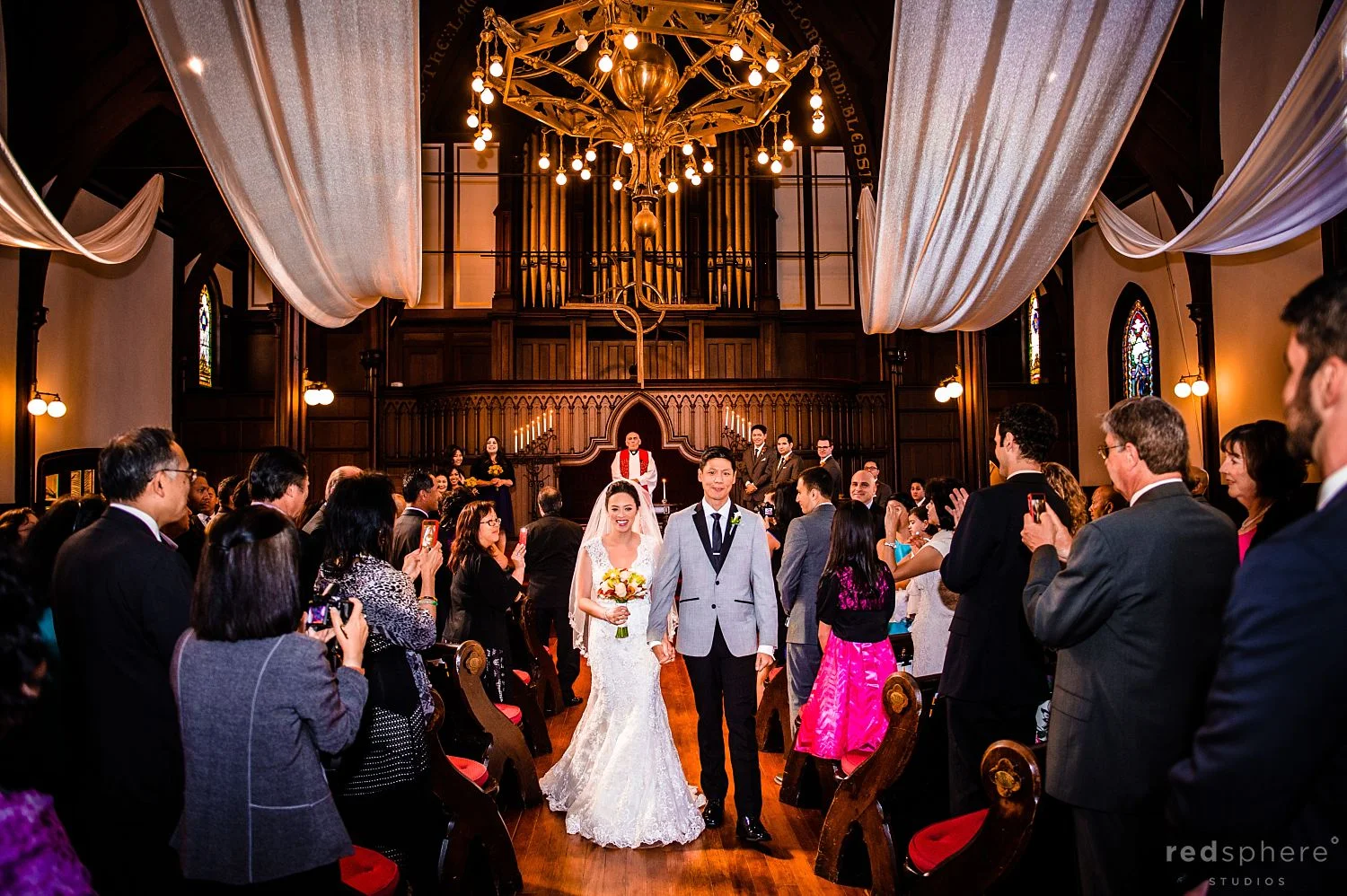 Bride and Groom Walk Hand in Hand After Wedding at St. John's Presbyterian Church