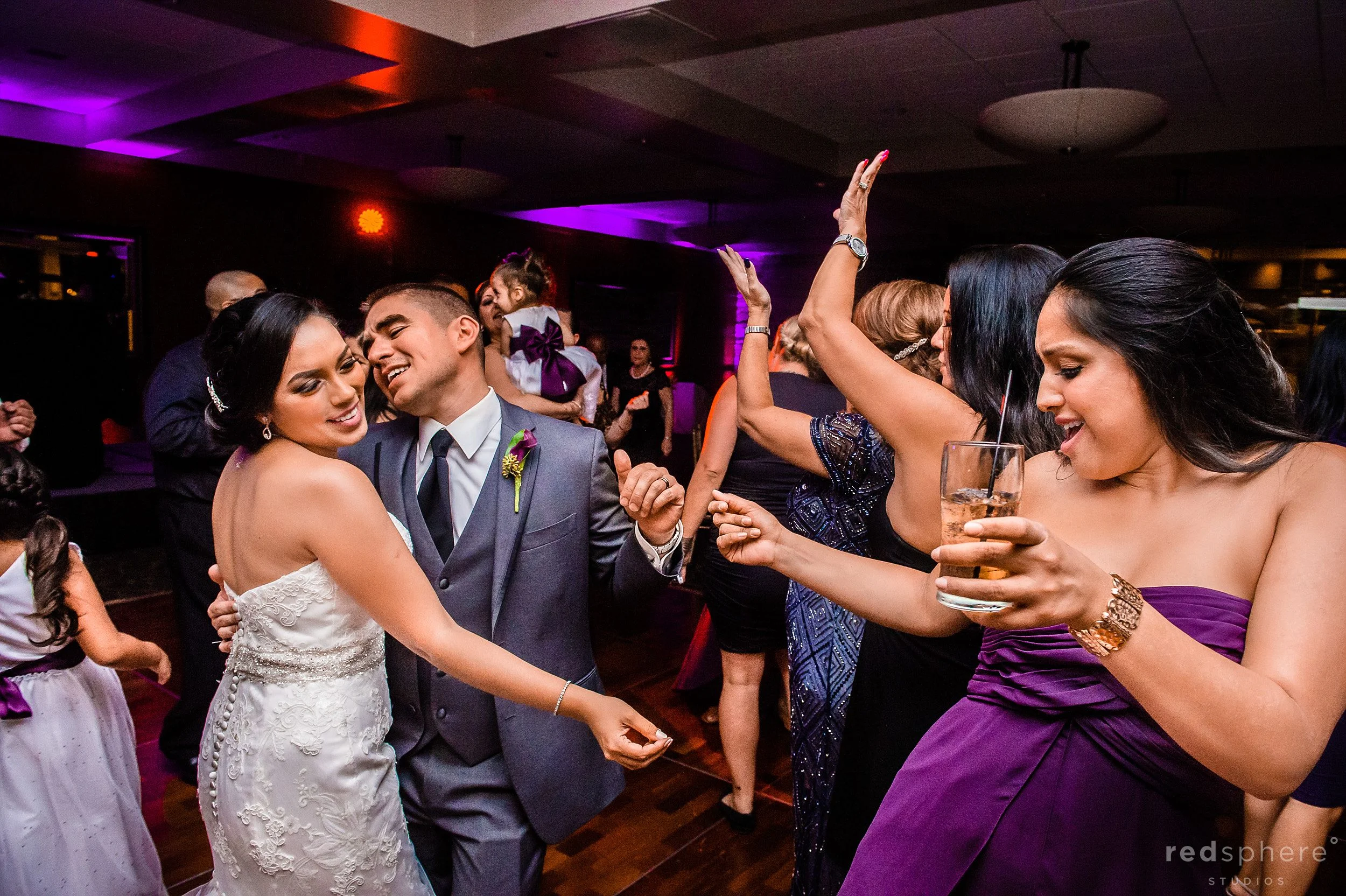 Bride and Groom Dancing With Bridesmaid