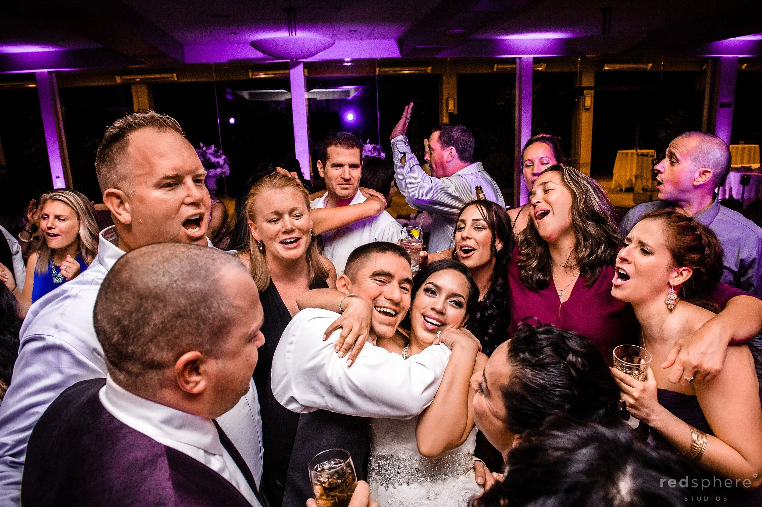 Bride and Groom Surrounded by Family and Friends as the Night Ends at Palo Alto Hills Golf Club