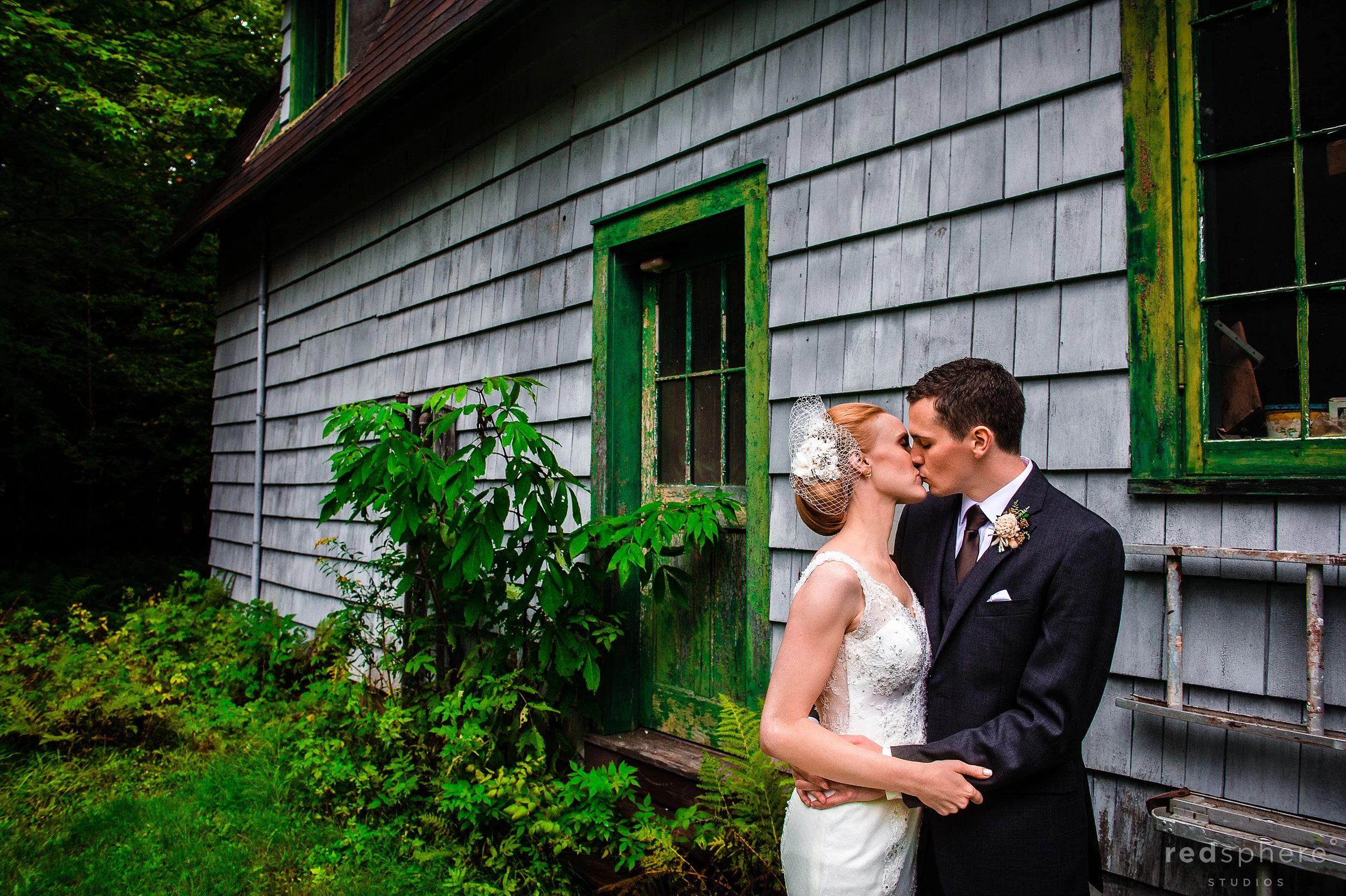 Bride and Groom Kiss Surrounded by Nature at Chapel Island, NY