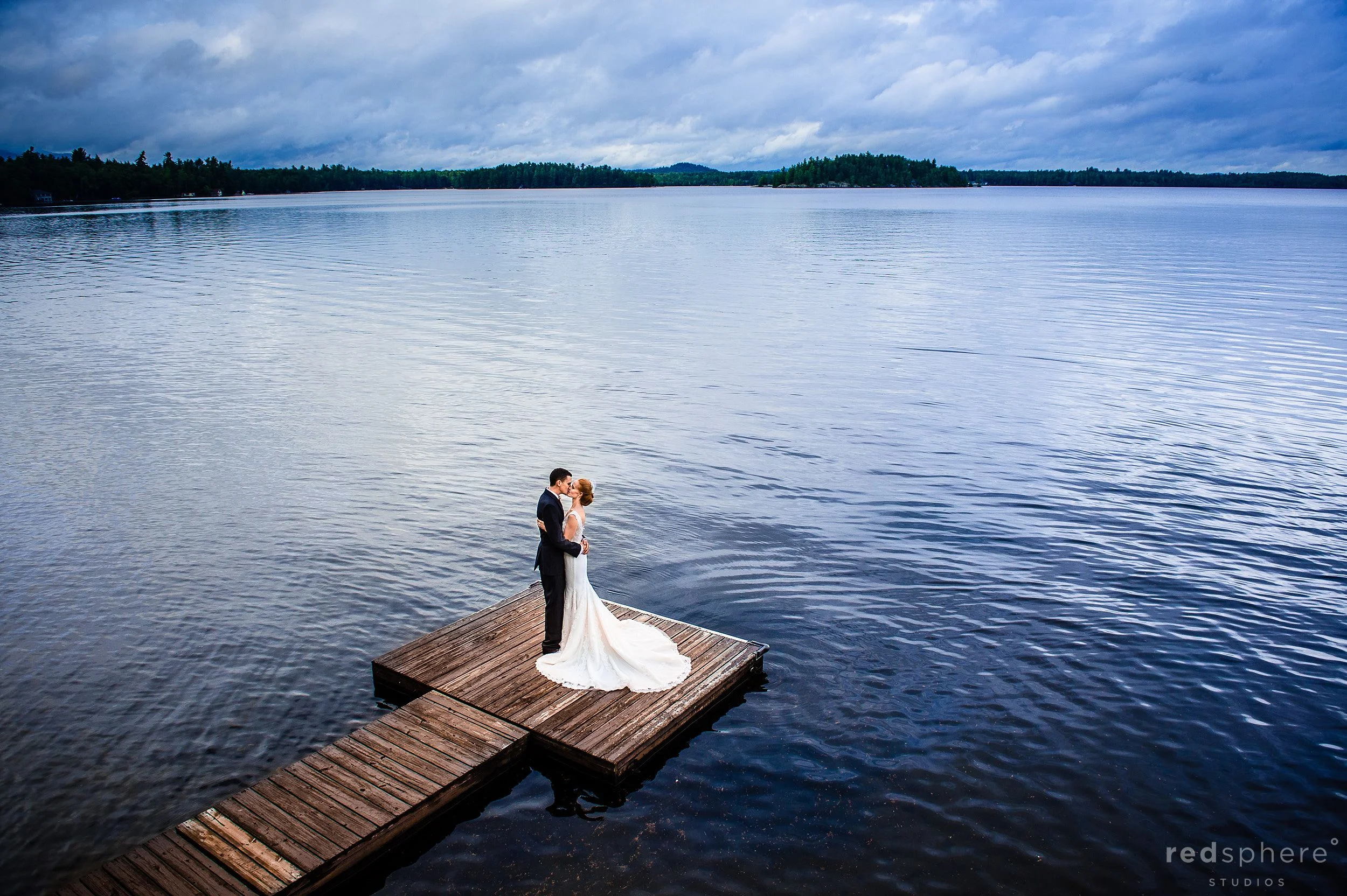 Bride and Groom on Saranac Lake Dock Aerial View