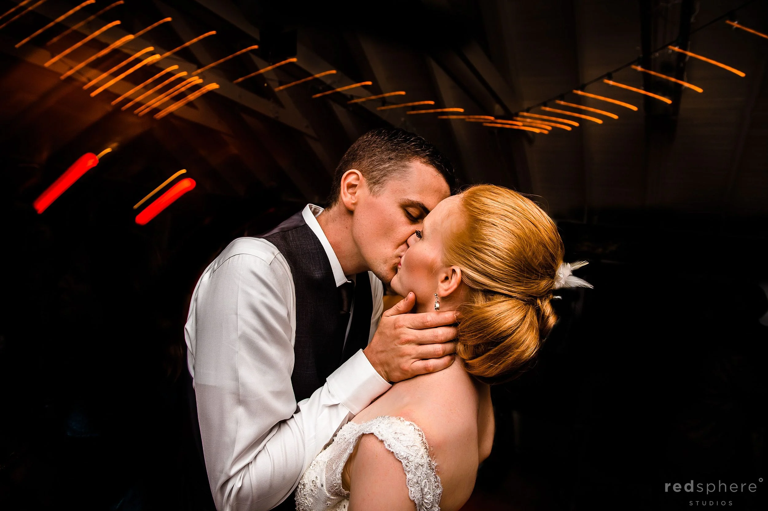 Bride and Groom Kiss While Dancing at Chapel Island Wedding Reception
