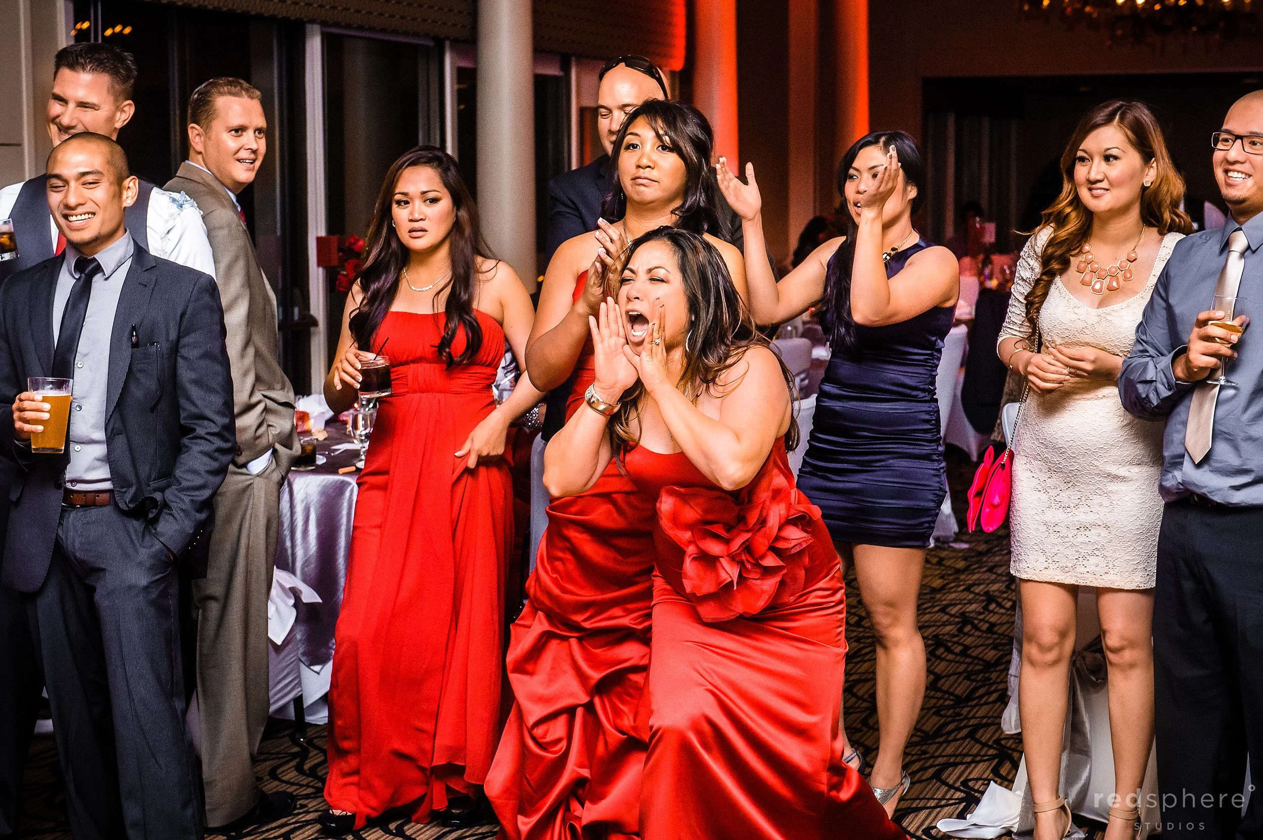 Bridesmaid Cheering On People On The Dance Floor