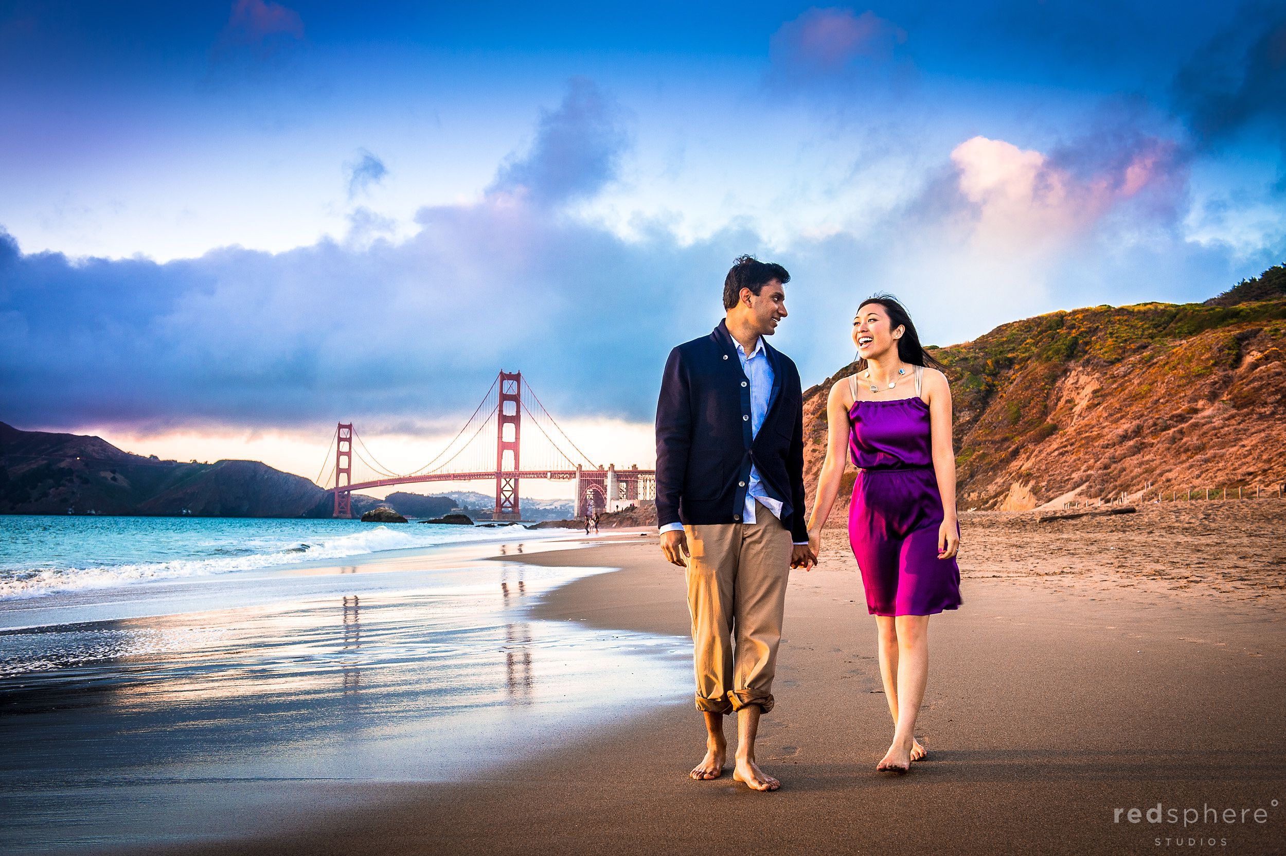 Couple Strolling and Sharing Laughs at Baker Beach Engagement
