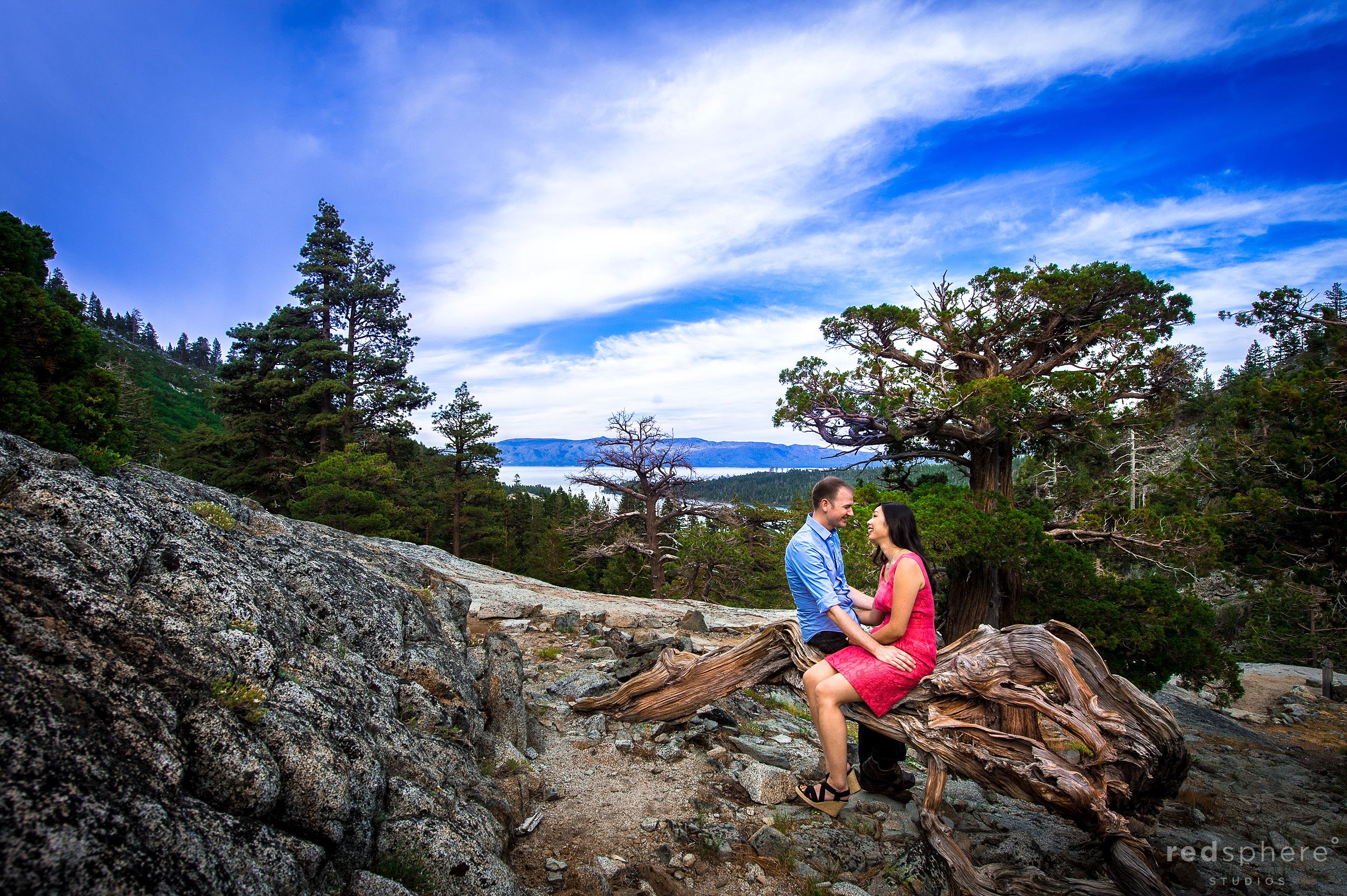 Couple Cozy Up on Rock, Lake Tahoe Engagements