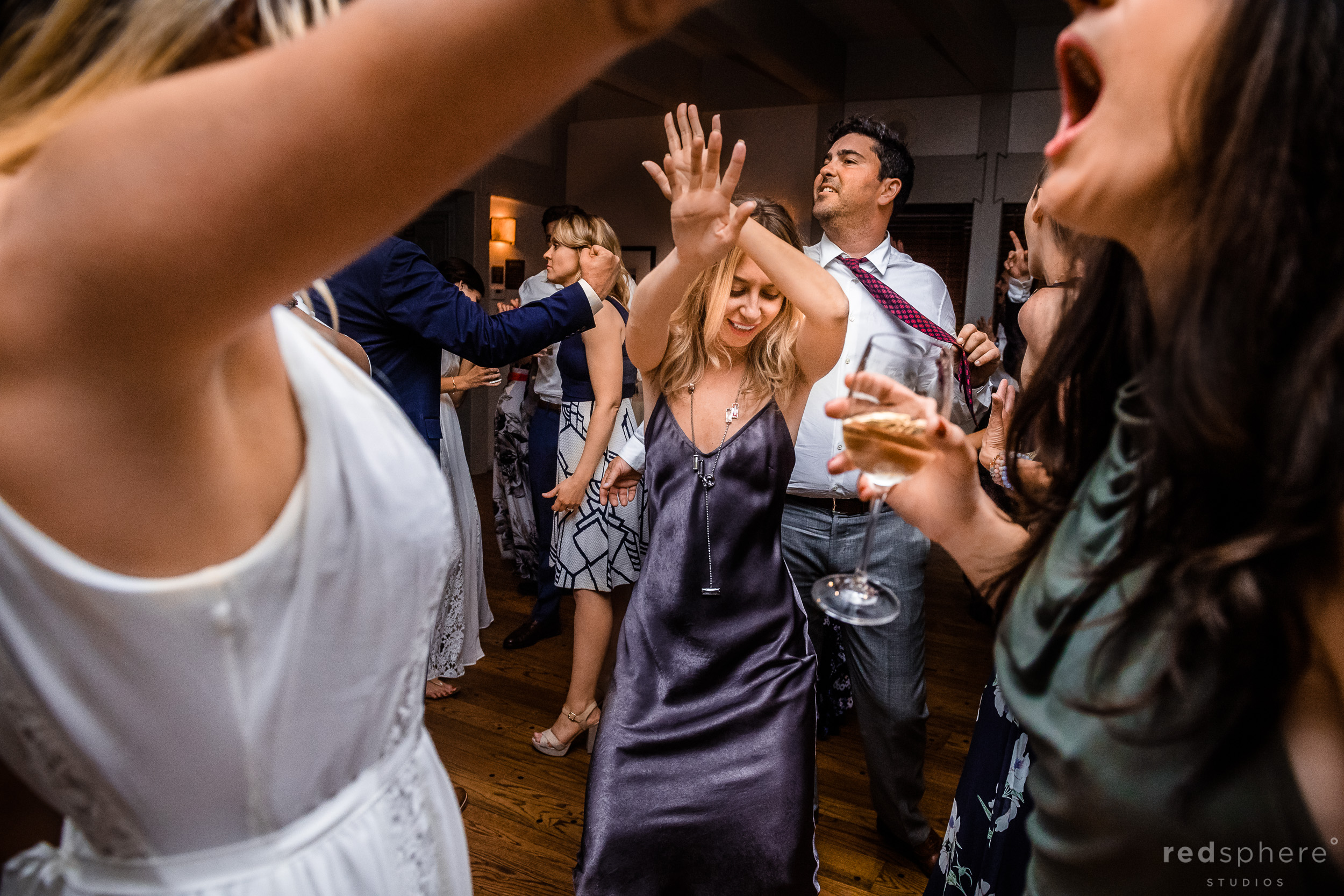 Wedding guests dancing during a wedding reception at Harvest Inn By Charlie Palmer, St. Helena, Napa Valley