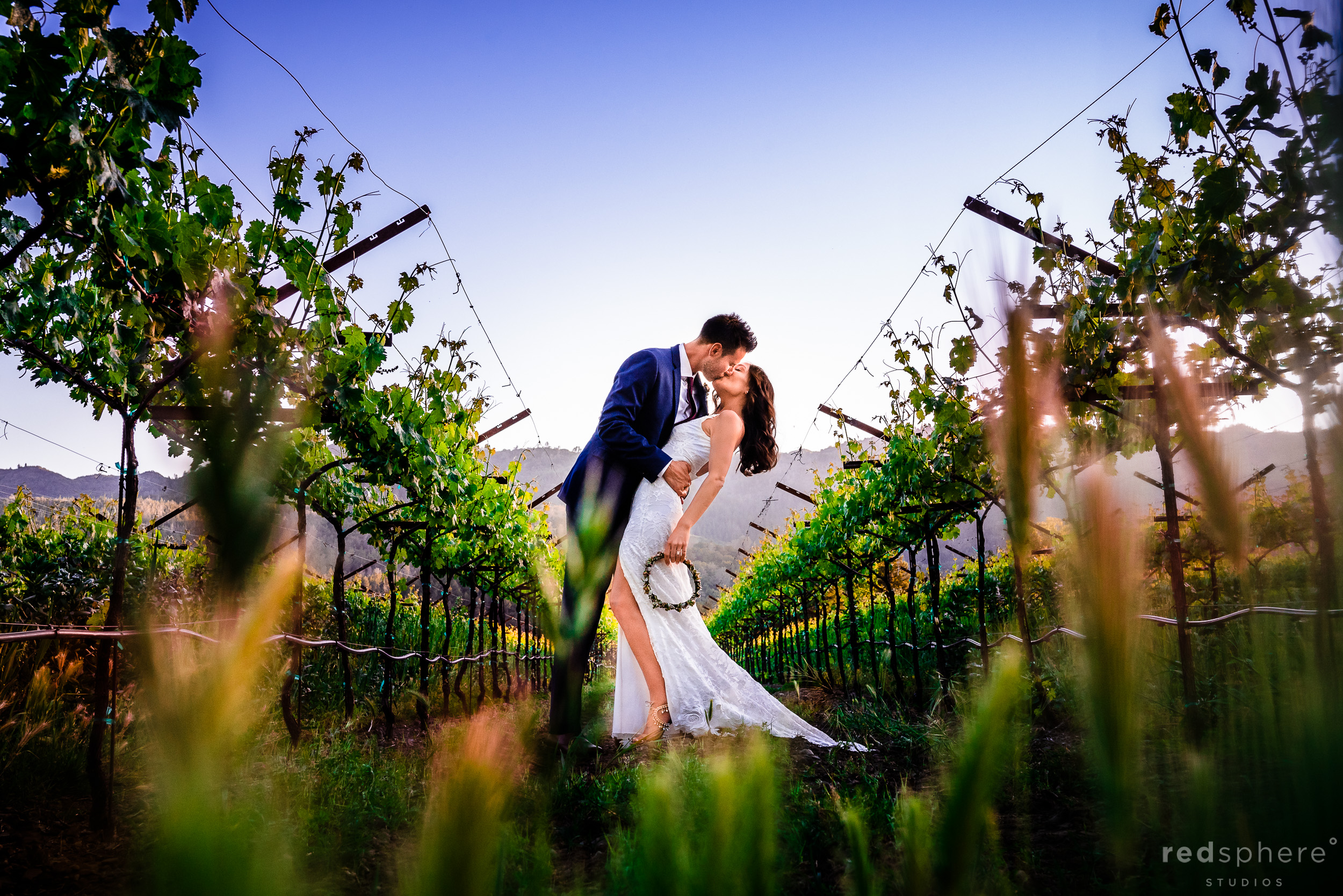 kiss wedding portrait at Harvest Inn By Charlie Palmer, St. Helena, Napa Valley, Bohemian Lace Wedding Dress from Grace Loves Lace