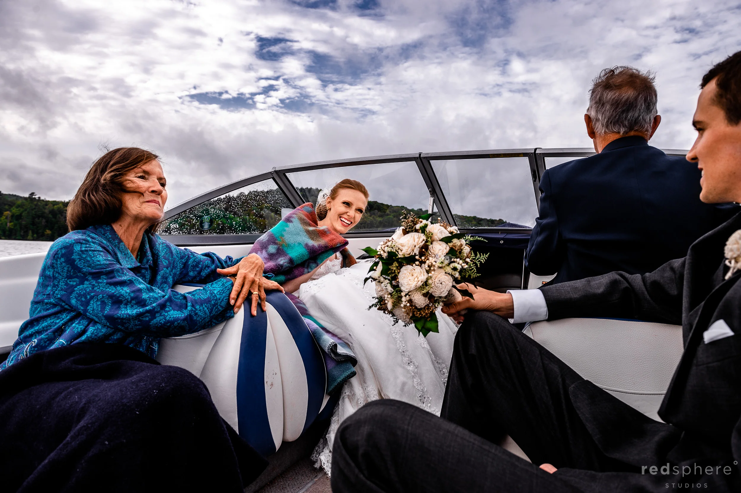 Bride and Groom Alongside Family on Boat at Saranac Lake New York