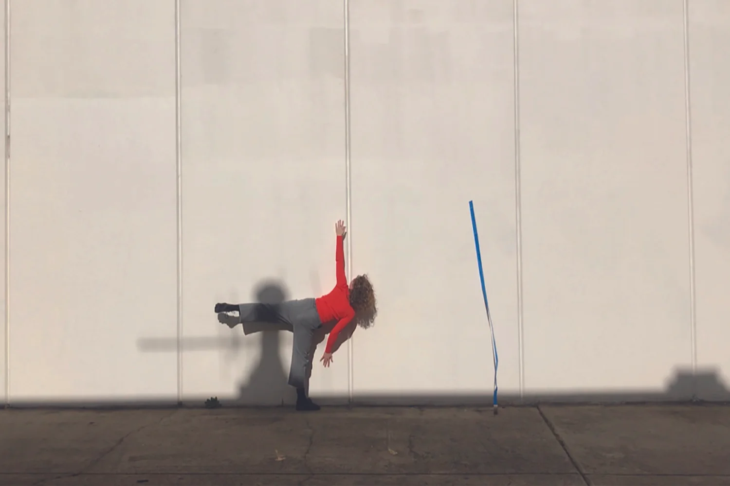  Grace Carver,  Facilitating Open Choreographies,  2018. Painters tape, exterior wall, dimensions variable. 