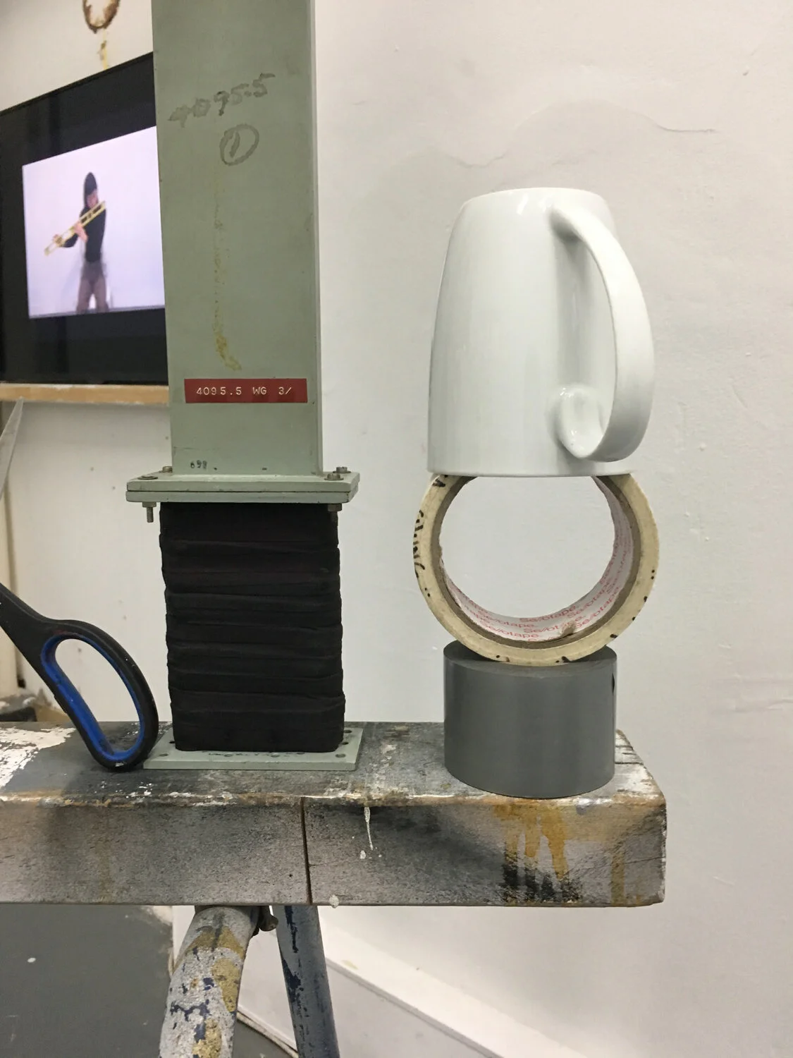  Luyuan Zhang, Instrument Practice, 2019. Hand TV monitor controllers, hemp twine, tea mug, masking tape, cloth tape, scissors, hand saw, sawhorse, used parts from dust collector, plastic tube, wood, file, bubble levels, hand grip sandpaper, dimensio