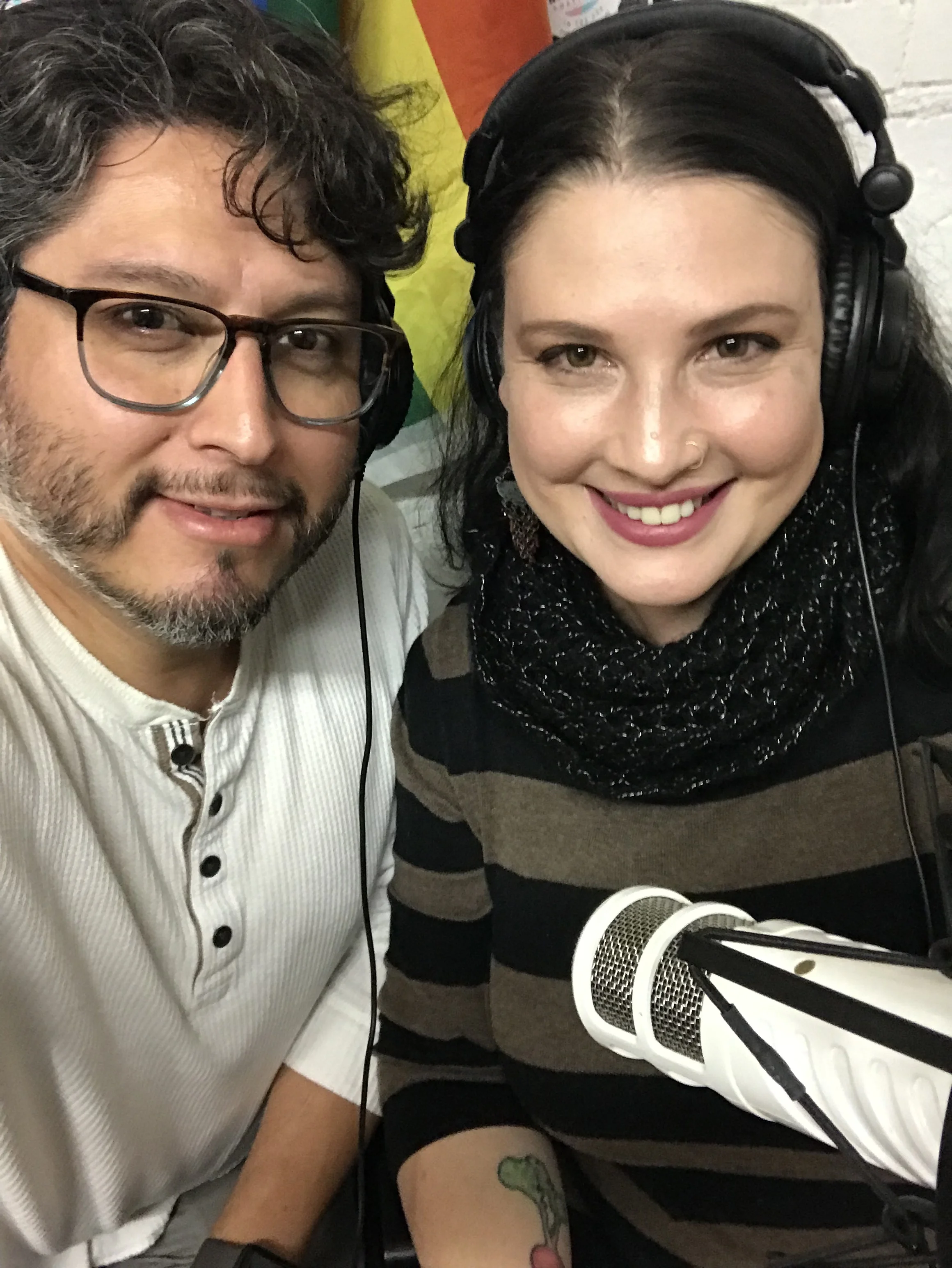 ALT TEXT: Photo of Tamara Rettino and Interviewer Xavier Mejia with microphone and wearing headphones