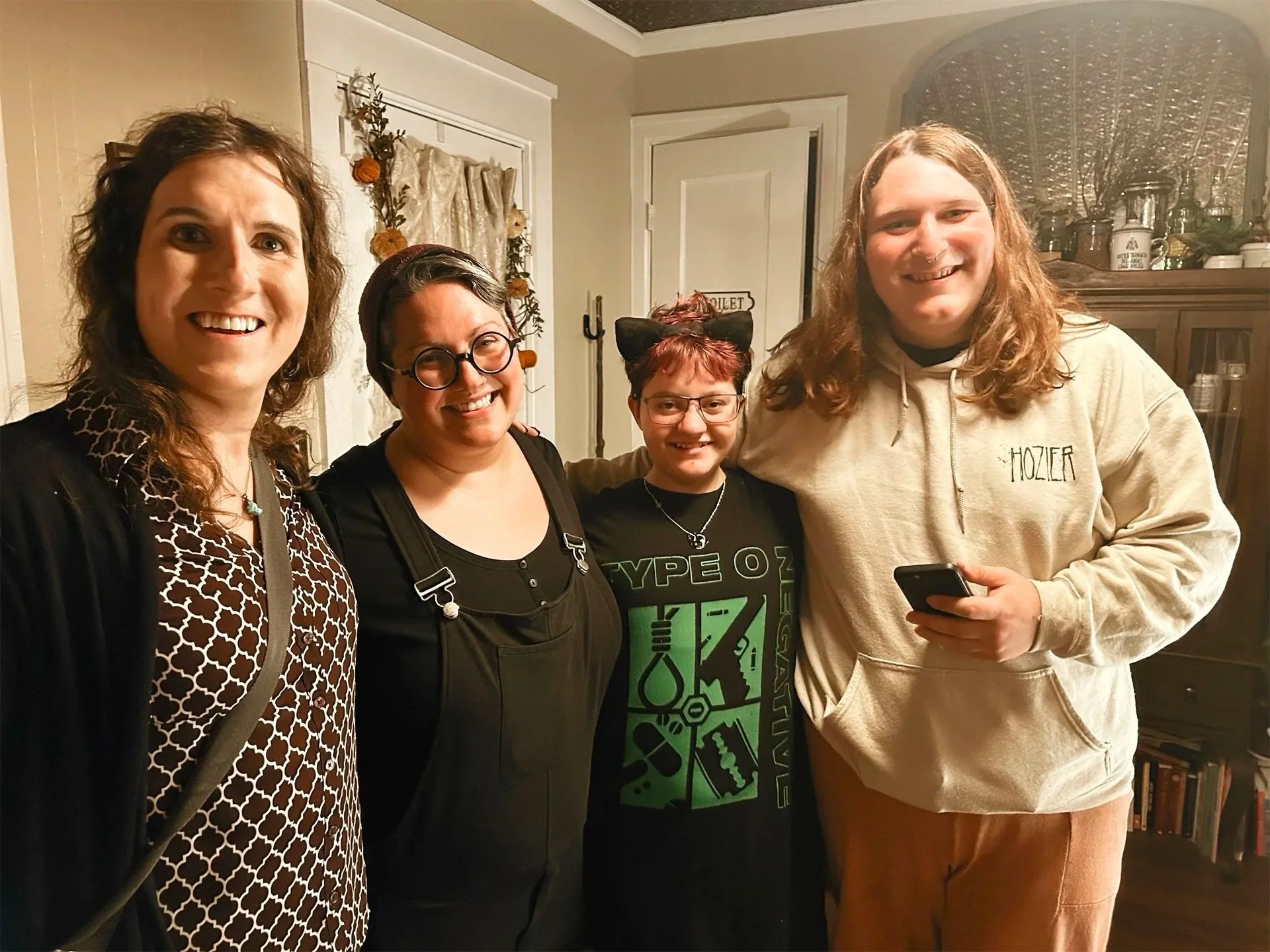 Four smiling people after receiving acupuncture, tea, and meditation at a free transgender and non-binary community night at Acupunktrix!