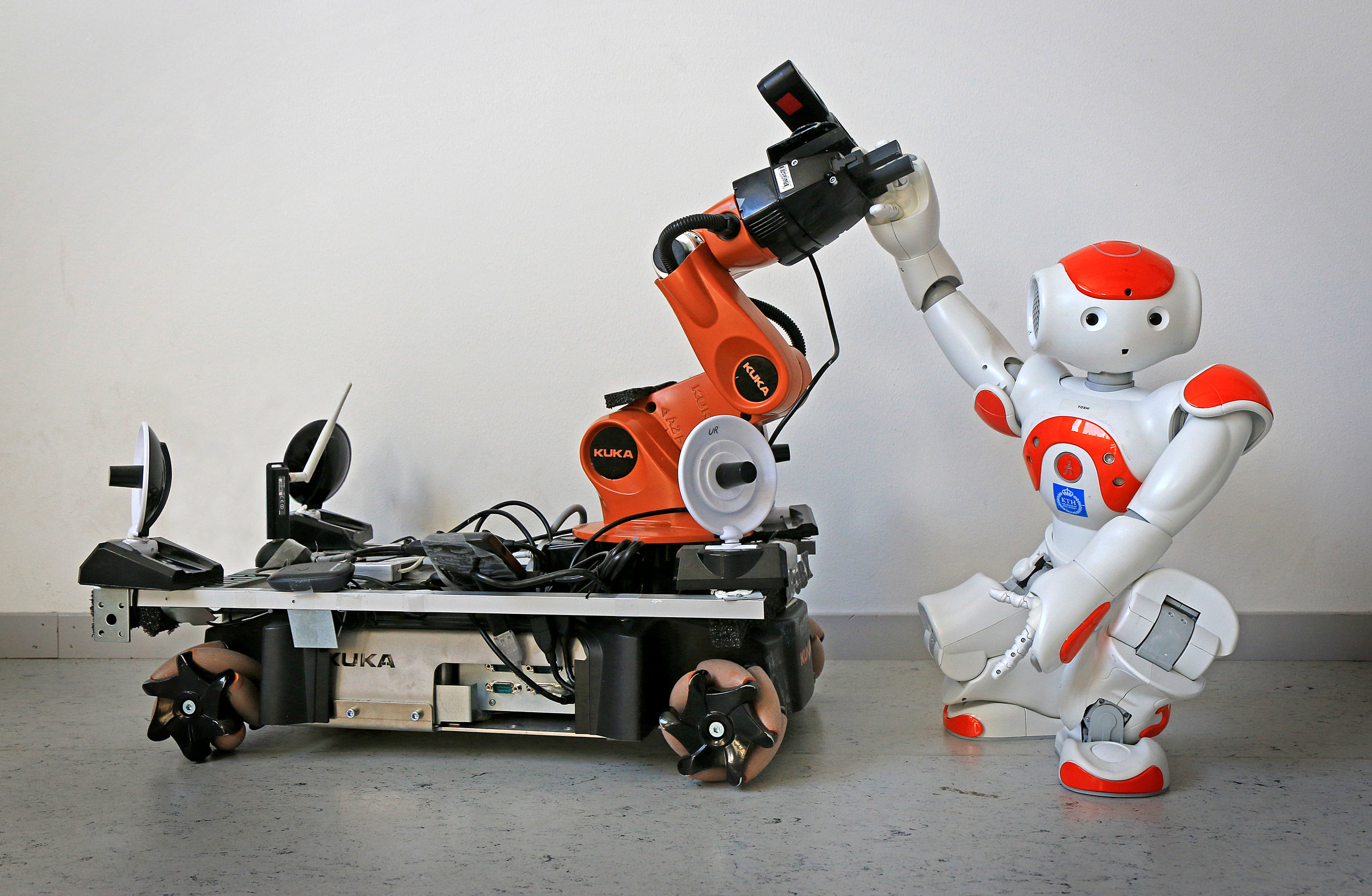 ' They have taught robots to cooperate ' by Peter Larsson ( CC BY 3.0 ), via Wikimedia Commons.