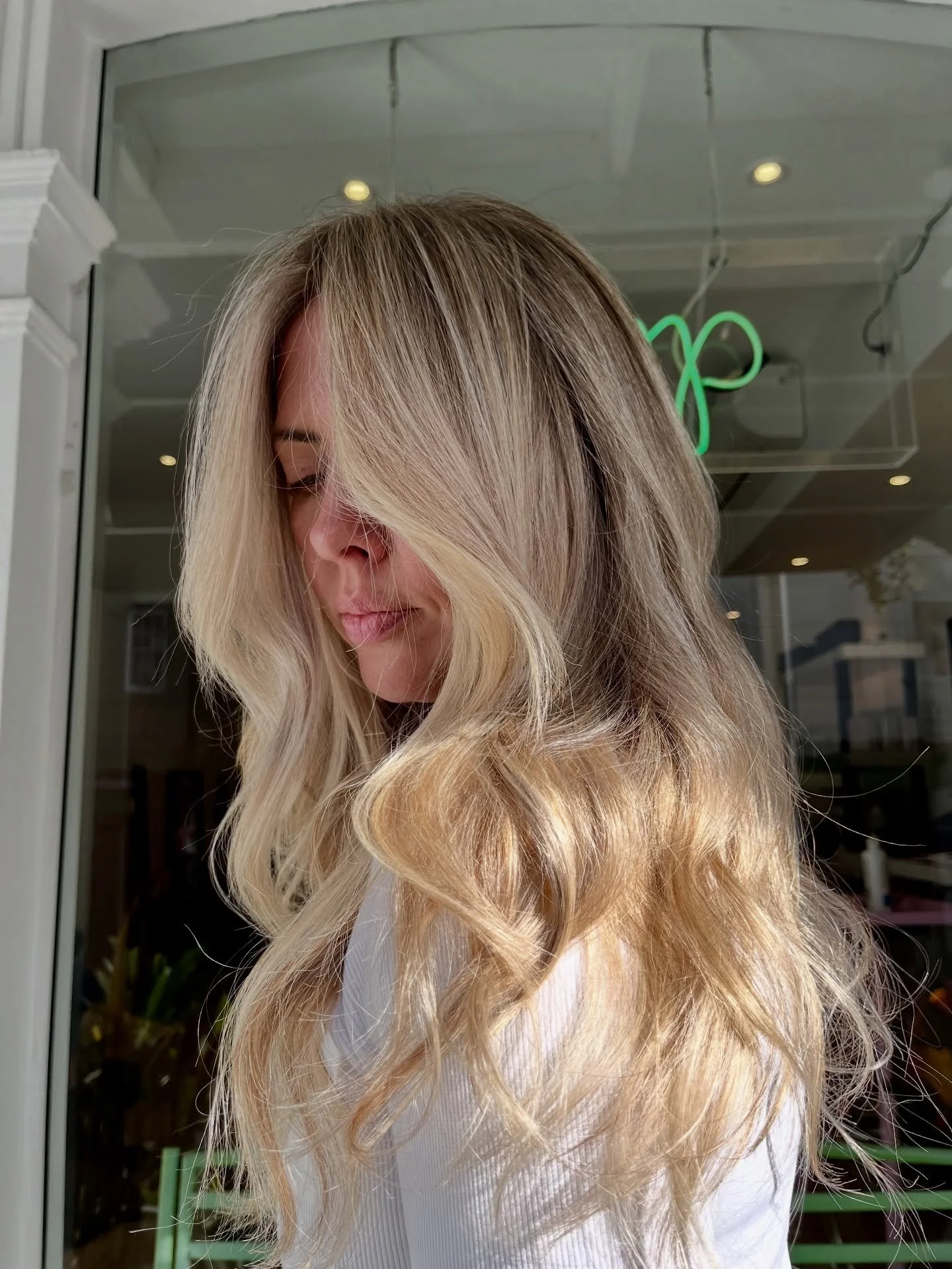 Clean up existing blonde and blending out the roots for a softer regrowth! 😍

Blending out but keeping the brightness especially around the face to create  blended contrast! 
.
.
.
.
.
#newhair #balayage #hair #waveyhair