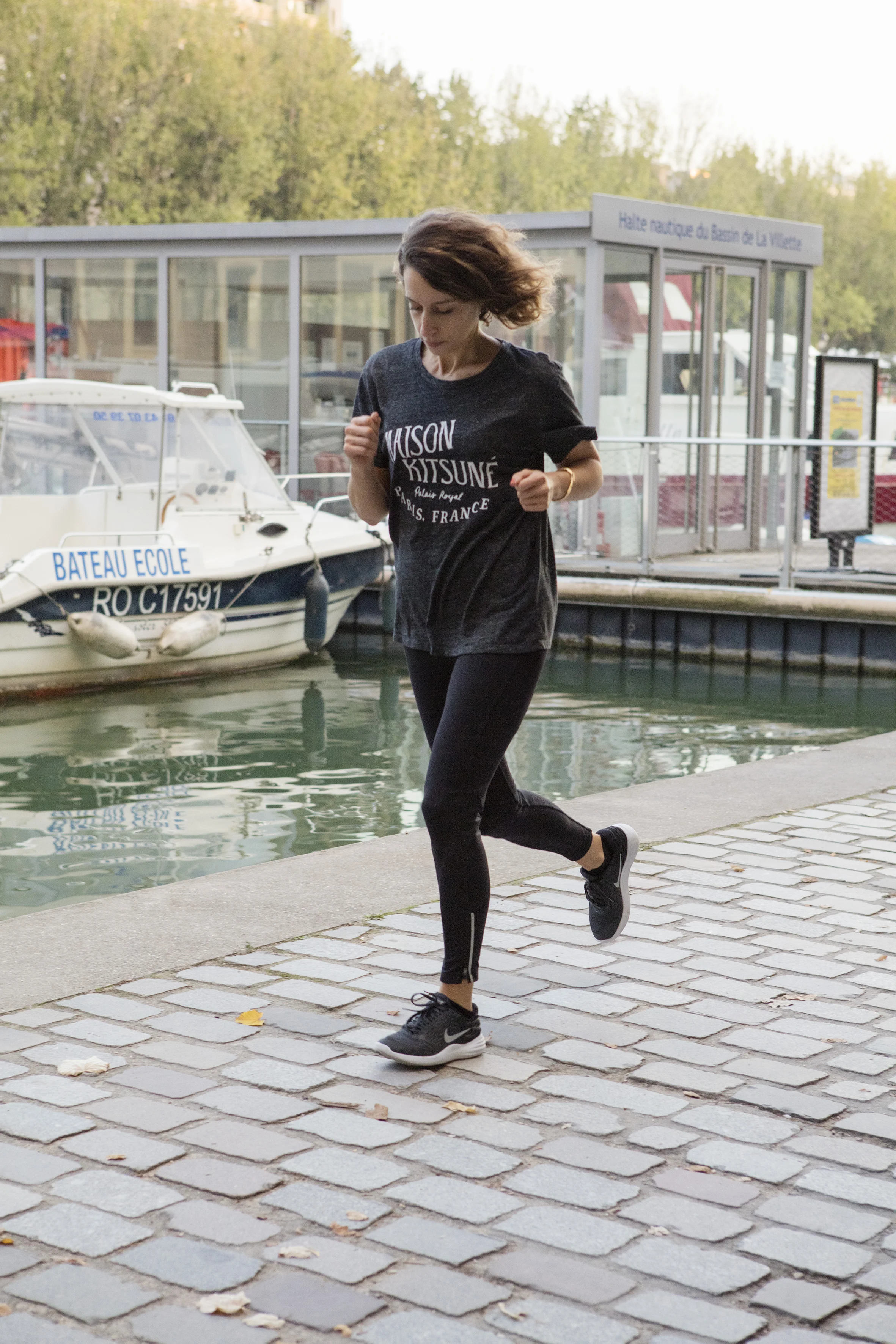 Tee-shirt: Maison Kitsuné. Leggings: Oysho. Running Shoes: Nike. All Images by Corinne Stoll .