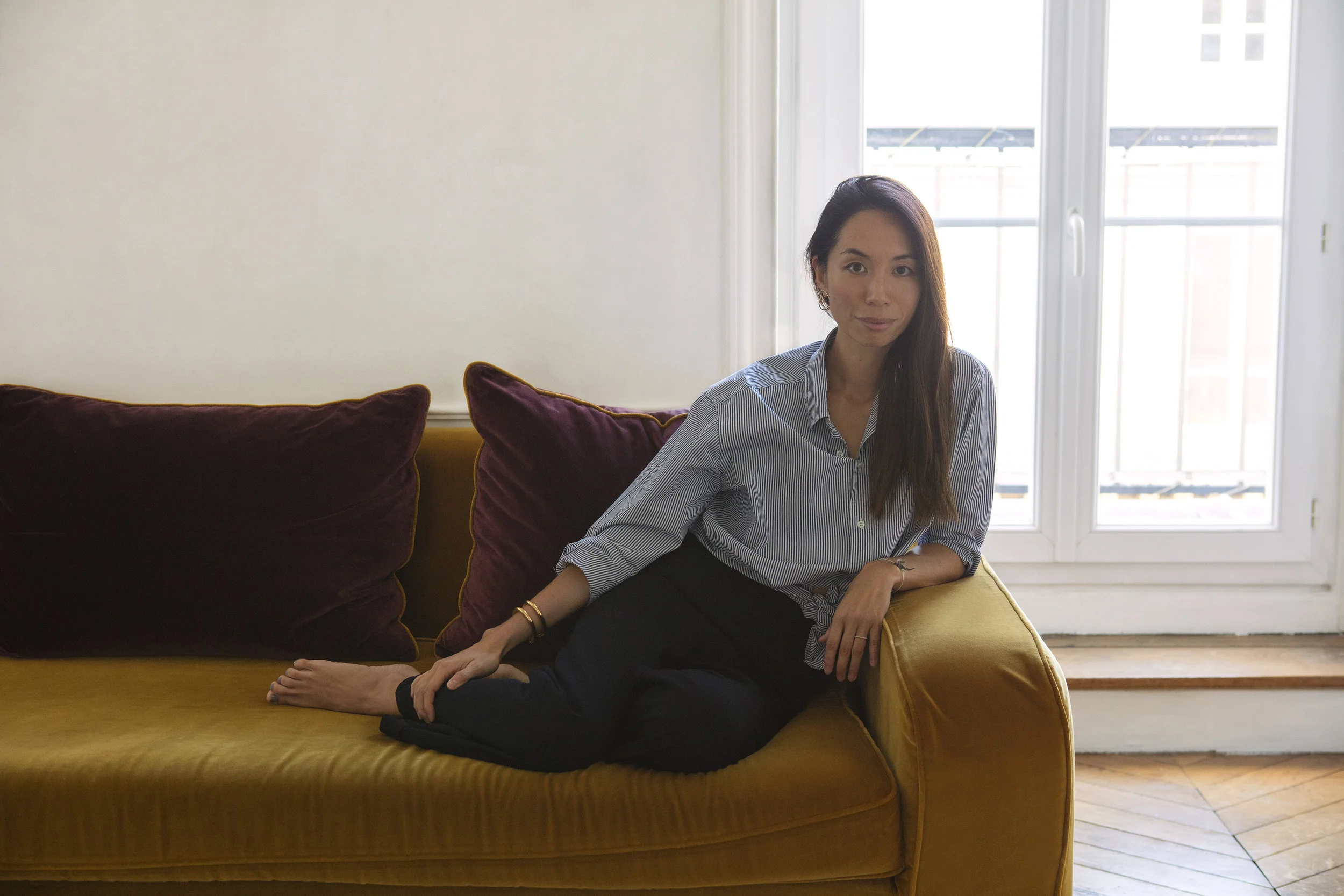 Shirt: Maison Kitsuné. Pants: Margaret Howell. Bracelet: Chloé. Earrings: Charlotte Chesnais. All images by Corinne Stoll .