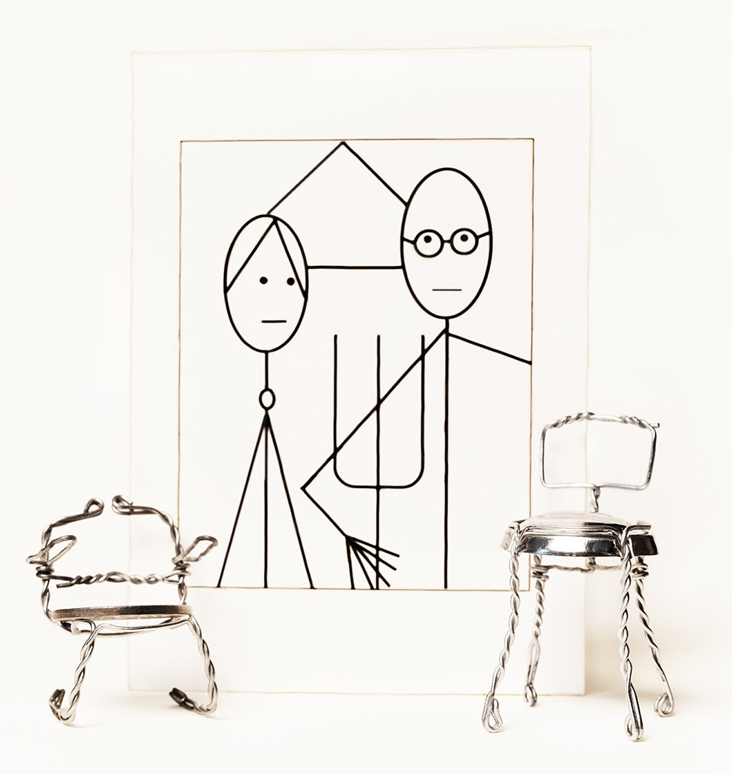    Chance Encounters    Champagne-Cork Wire Chairs by  Oscar Martin; A Card by Jeffrey  Metzner Referring to Grant Wood’s  Painting - ‘American Gothic’ 1930 ,  2023 64 cm x 60.5cm Archival pigment print  on 310gsm cotton rag   