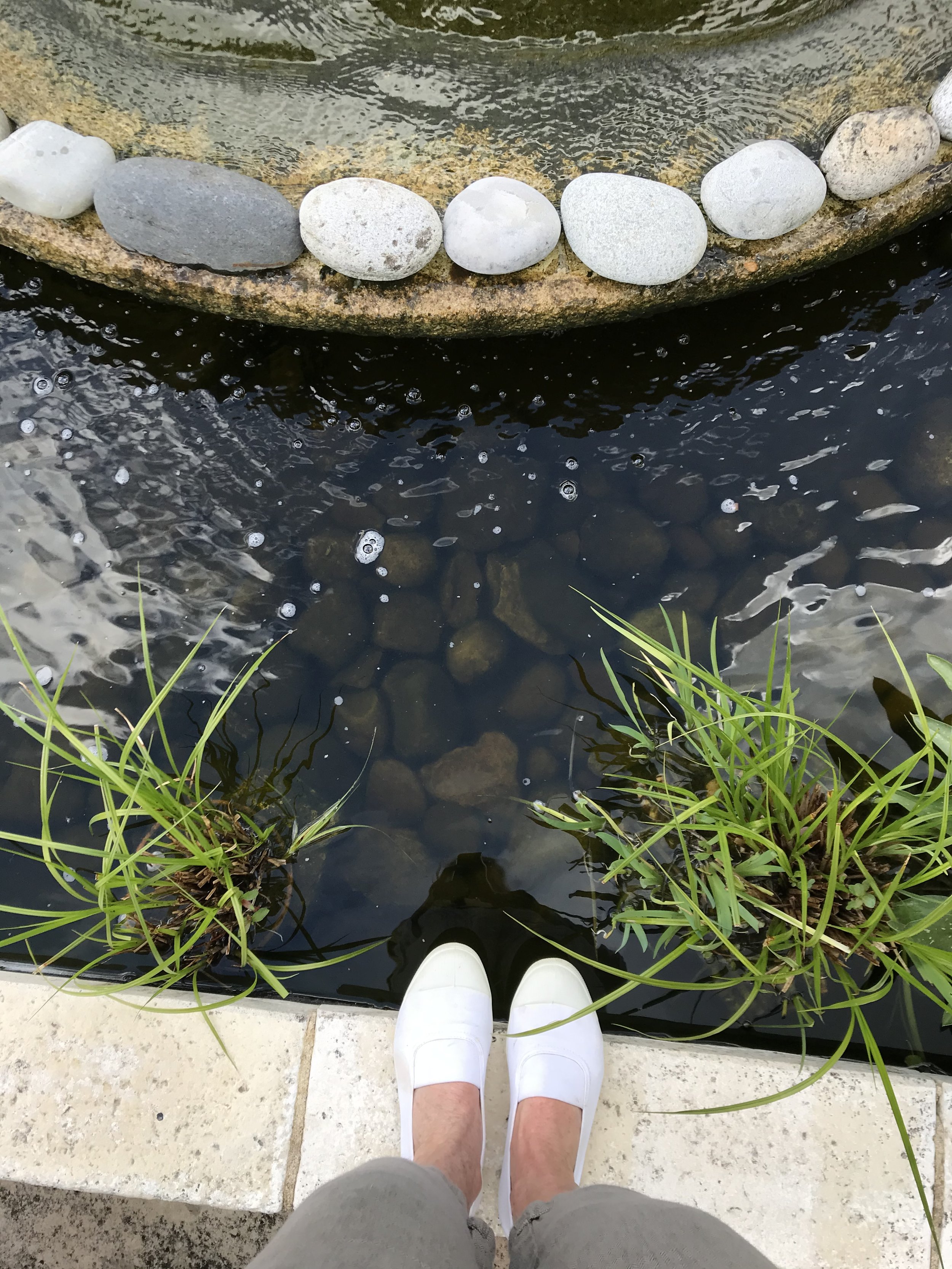 A guest enjoying the gardens at Les Soeurs Anglaises