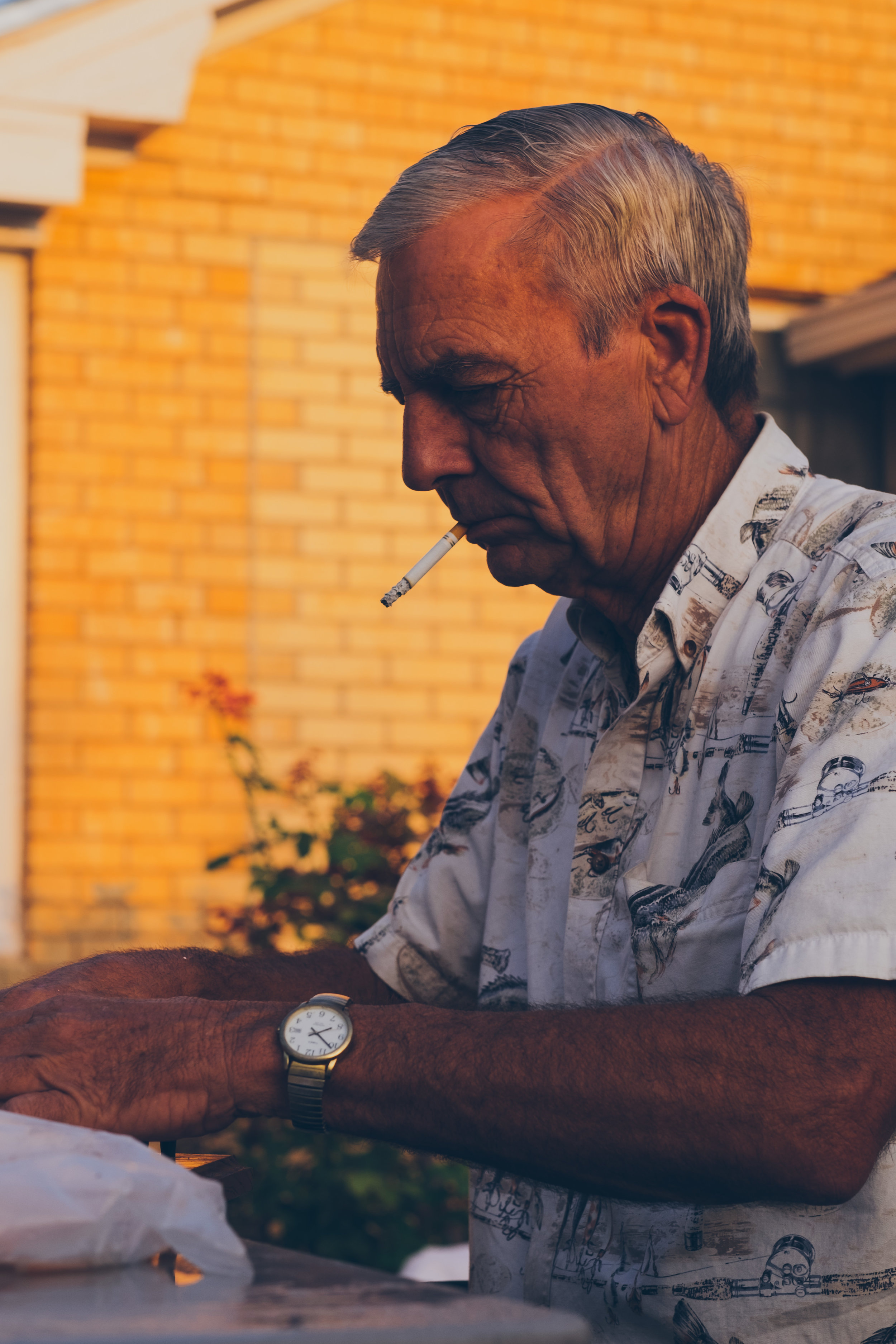  This is my great uncle, "Sonney". He always prepares a big lunch on Saturday - fried fish, hush puppies, and fries. Inside, my cousins and aunts are preparing the side to go along with the supper. 