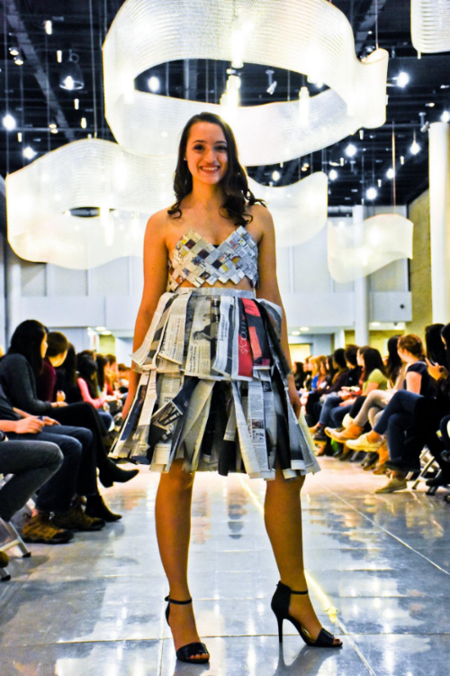 Sam modeling her outfit made completely out of newspaper!