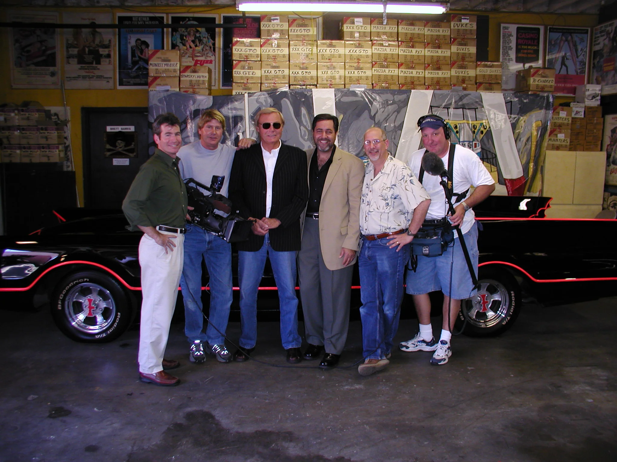 Adam West, the original batman with our crew in front of the world's most famous automobile - the original Batmobile