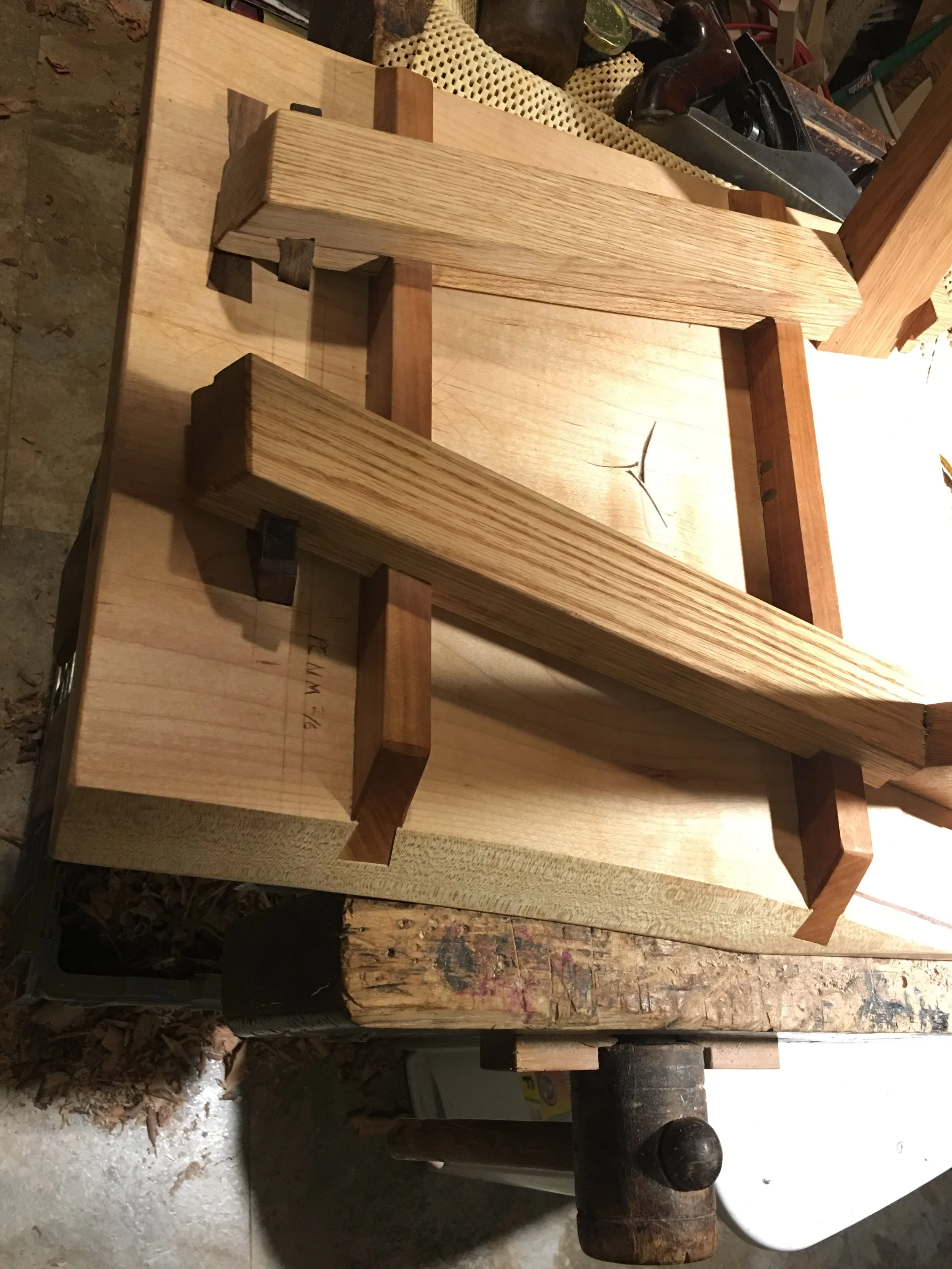 Page Chair underside showing handmade wooden joinery and assembly process by Matthew McEntee