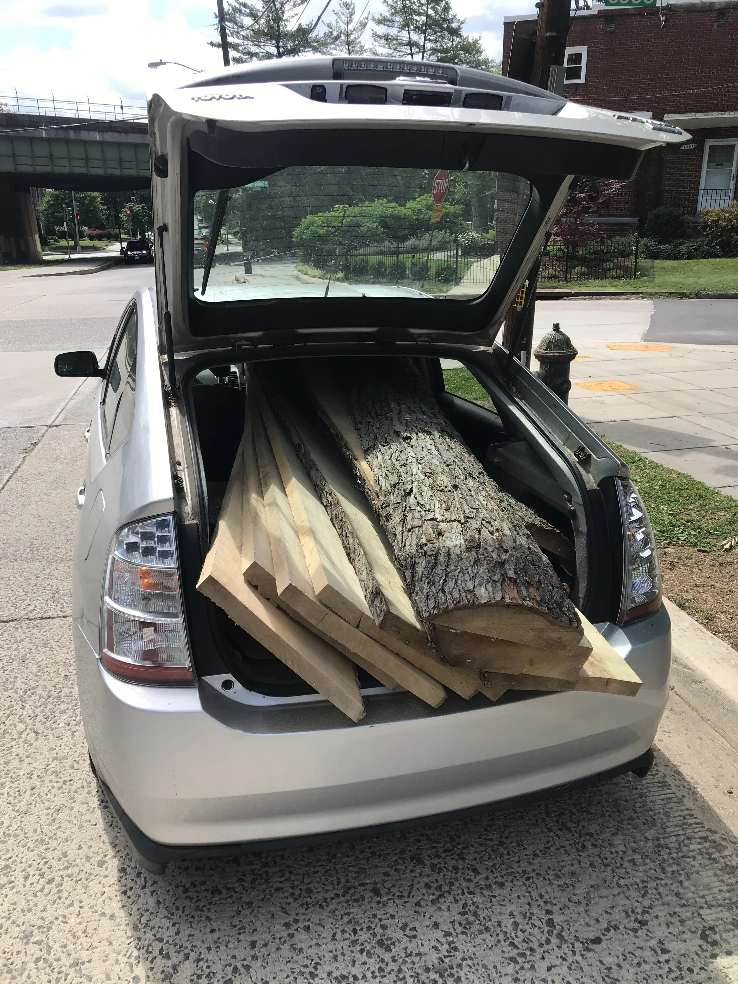 Large slabs of milled silver maple in a Prius that I use as a work truck