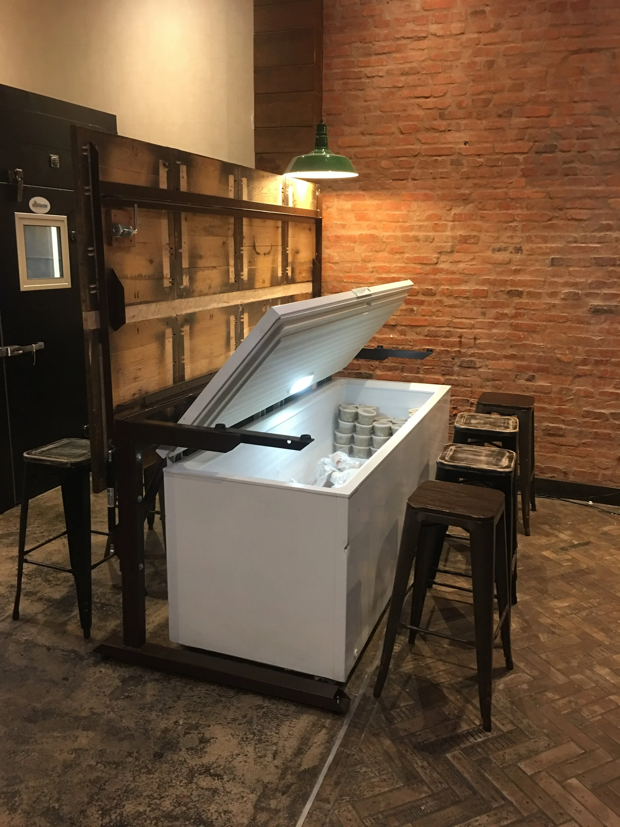 Table surface lifts for access to freezer