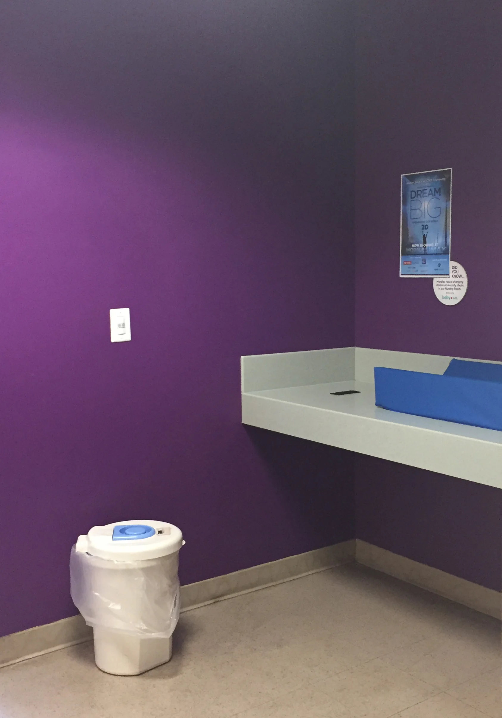 Dark purple walls in the changing area. 