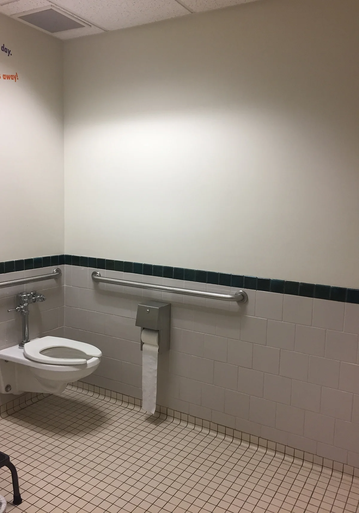 Off-white walls in the attached restroom.