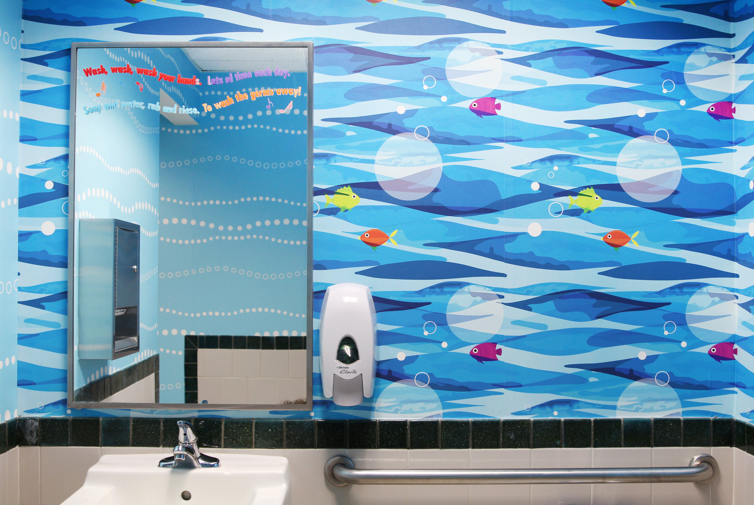 Here, you can see both custom patterns, the fish along one wall and the fun blue and white bubbles reflected in the mirror. 