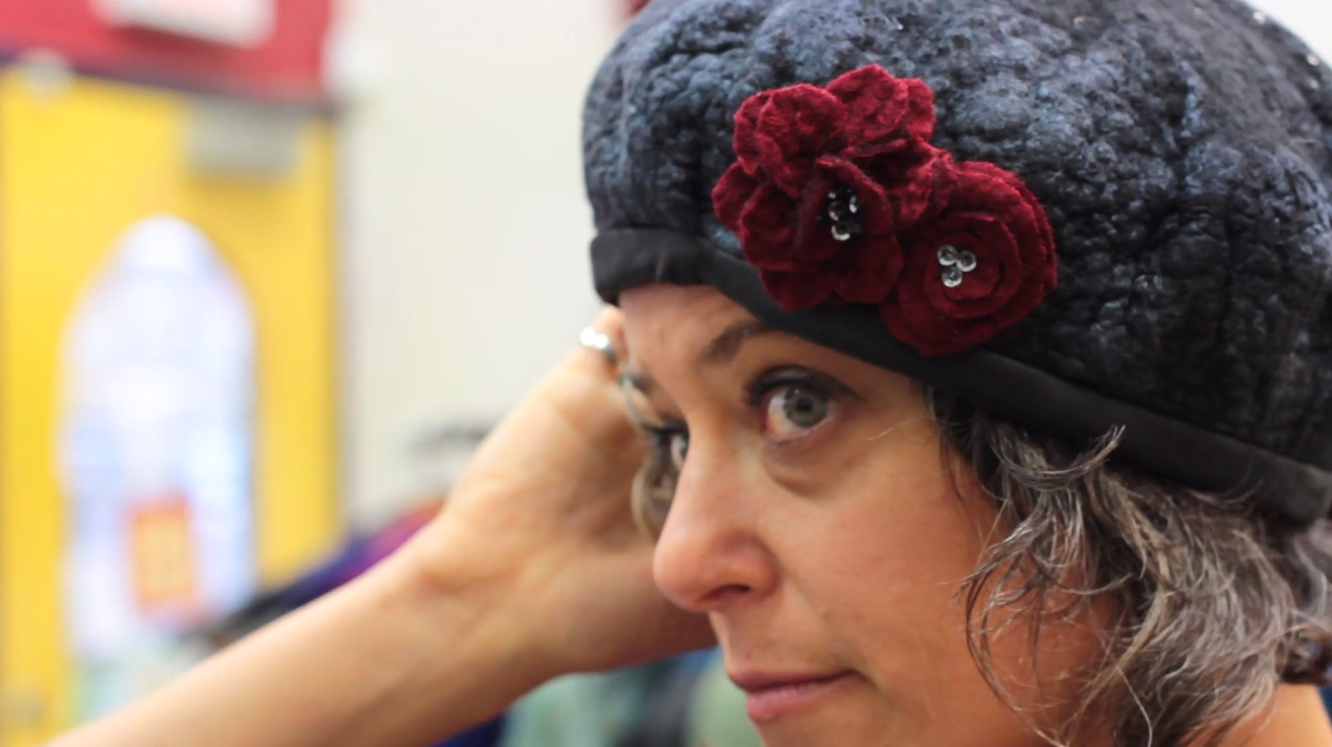 A completed Funk Shui felted hat embellised with hand-crafted felt flowers