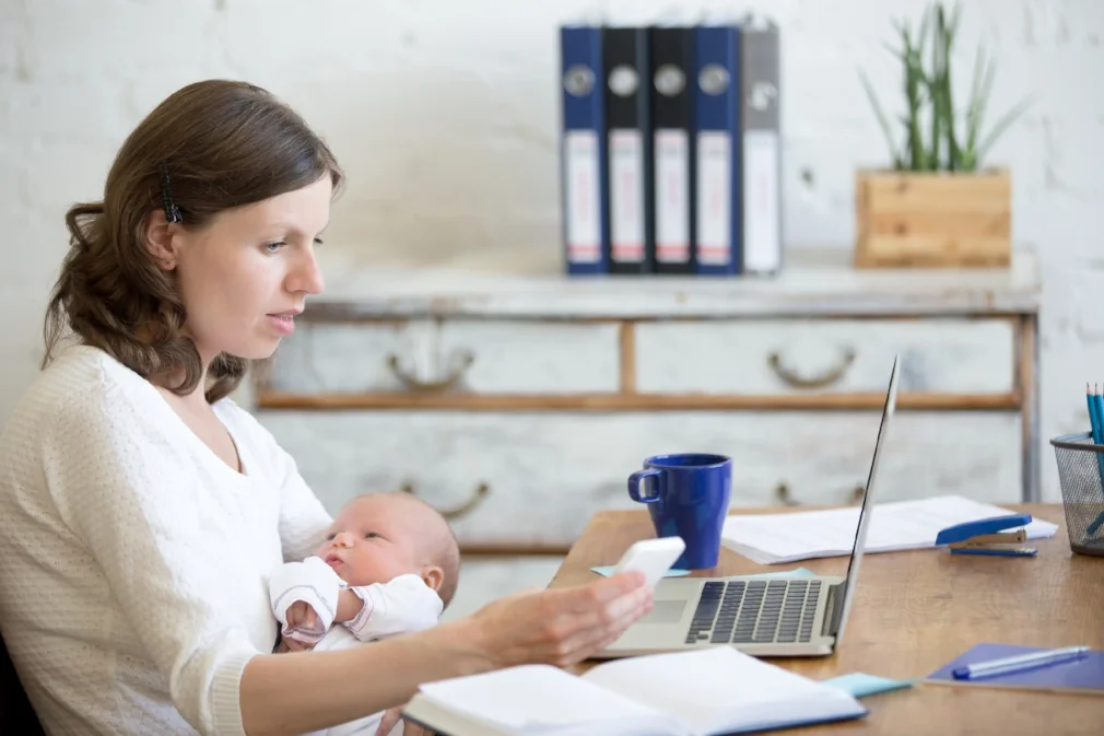 iStock- Mom-Baby-Computer-neck pain.jpg